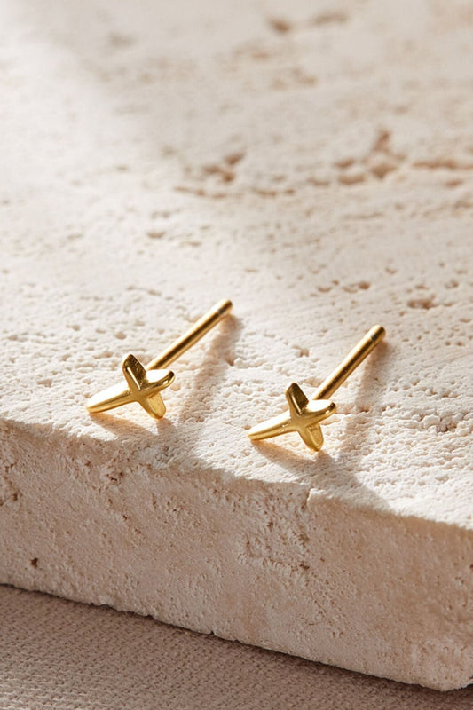 sterling-silver-tiny-cross-studs-in-gold-closeup