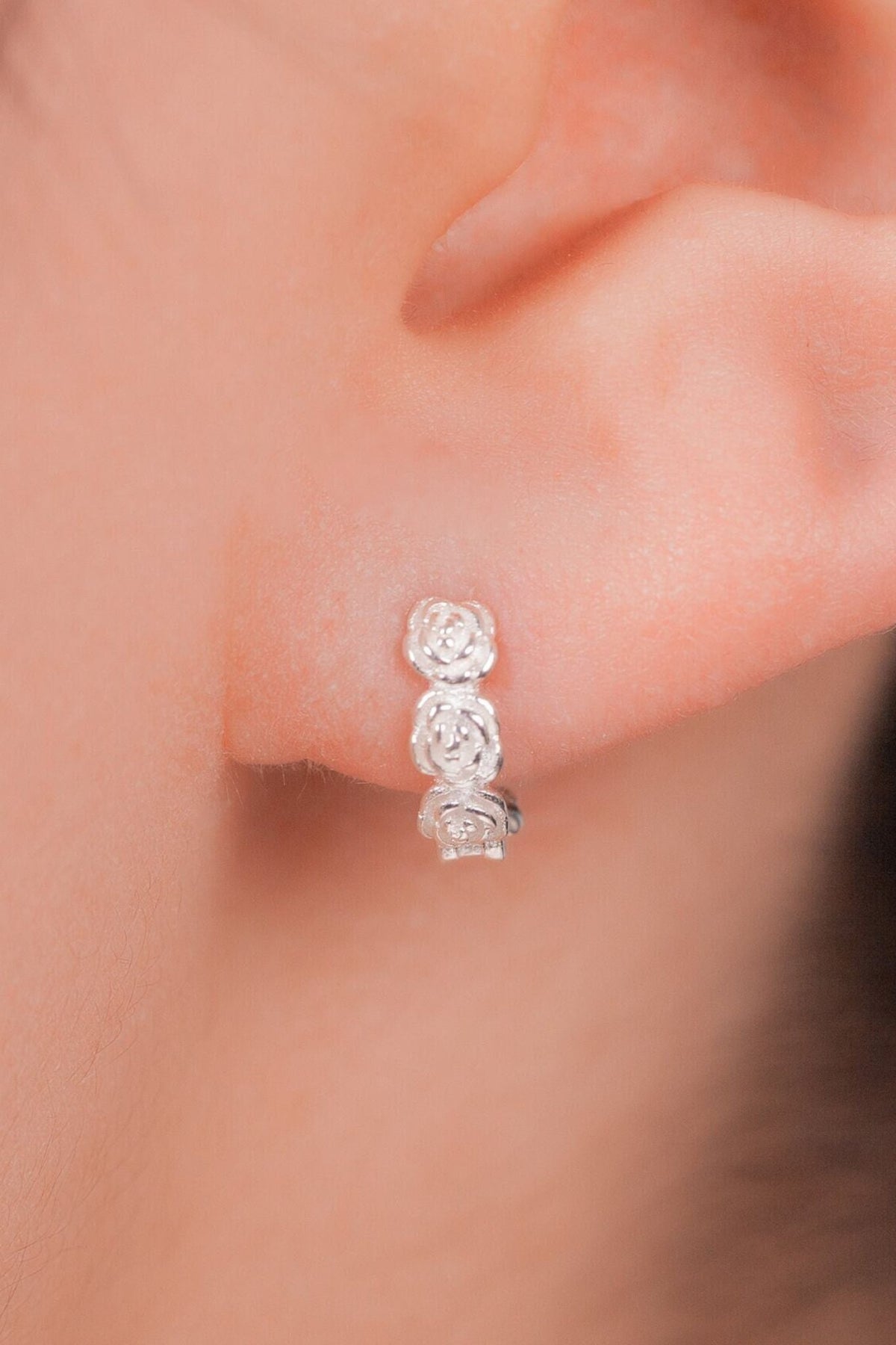 sterling-silver-rose-huggie-hoops-model