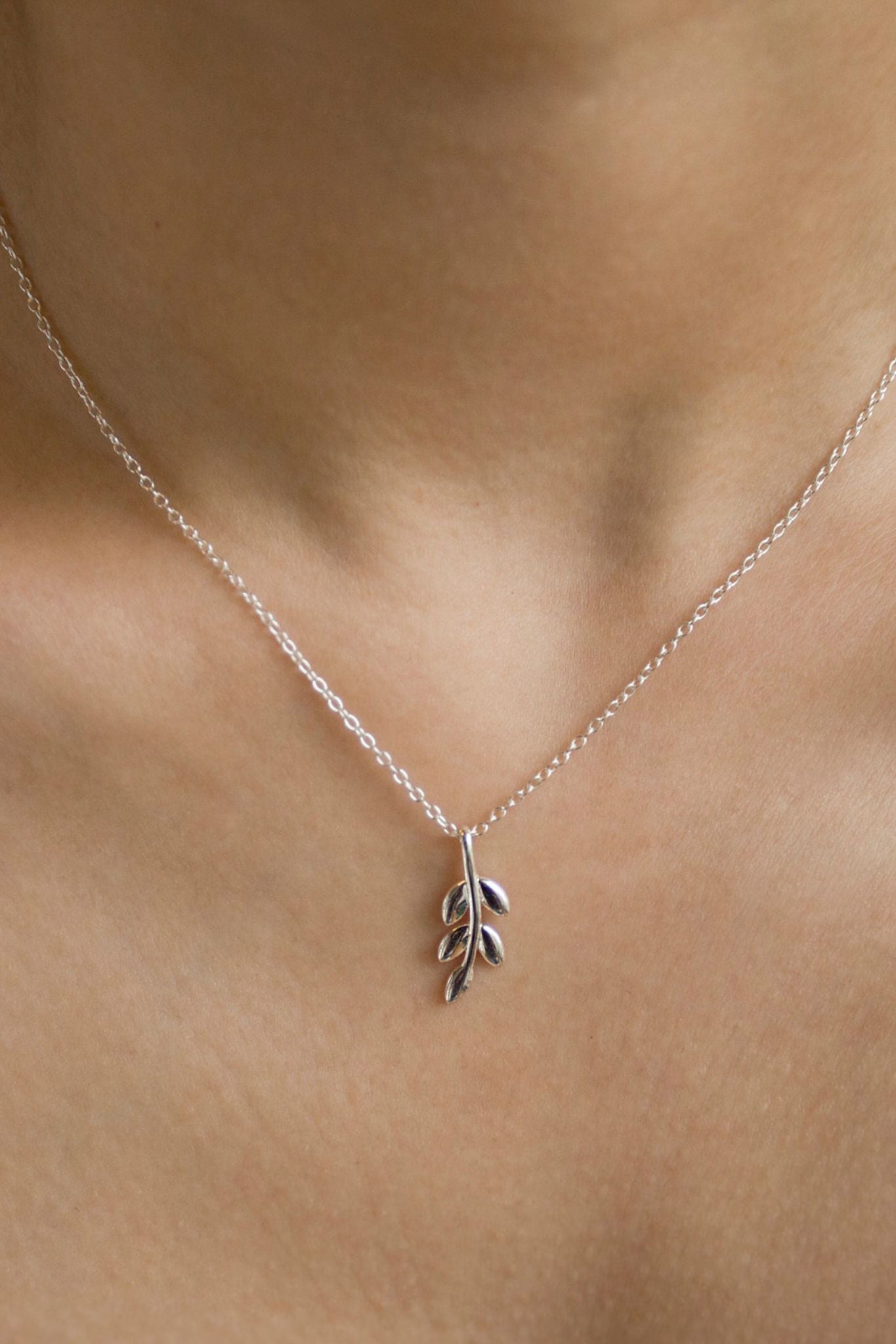 sterling-silver-vertical-olive-leaf-necklace-model-neckline