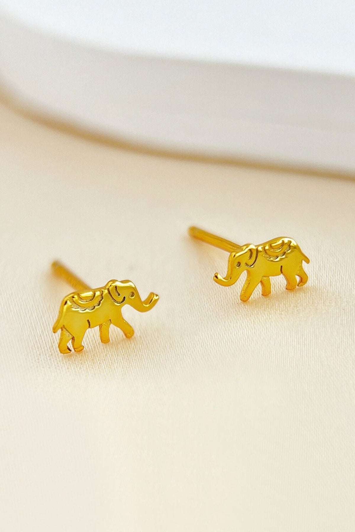 sterling-silver-tiny-elephant-studs-in-gold