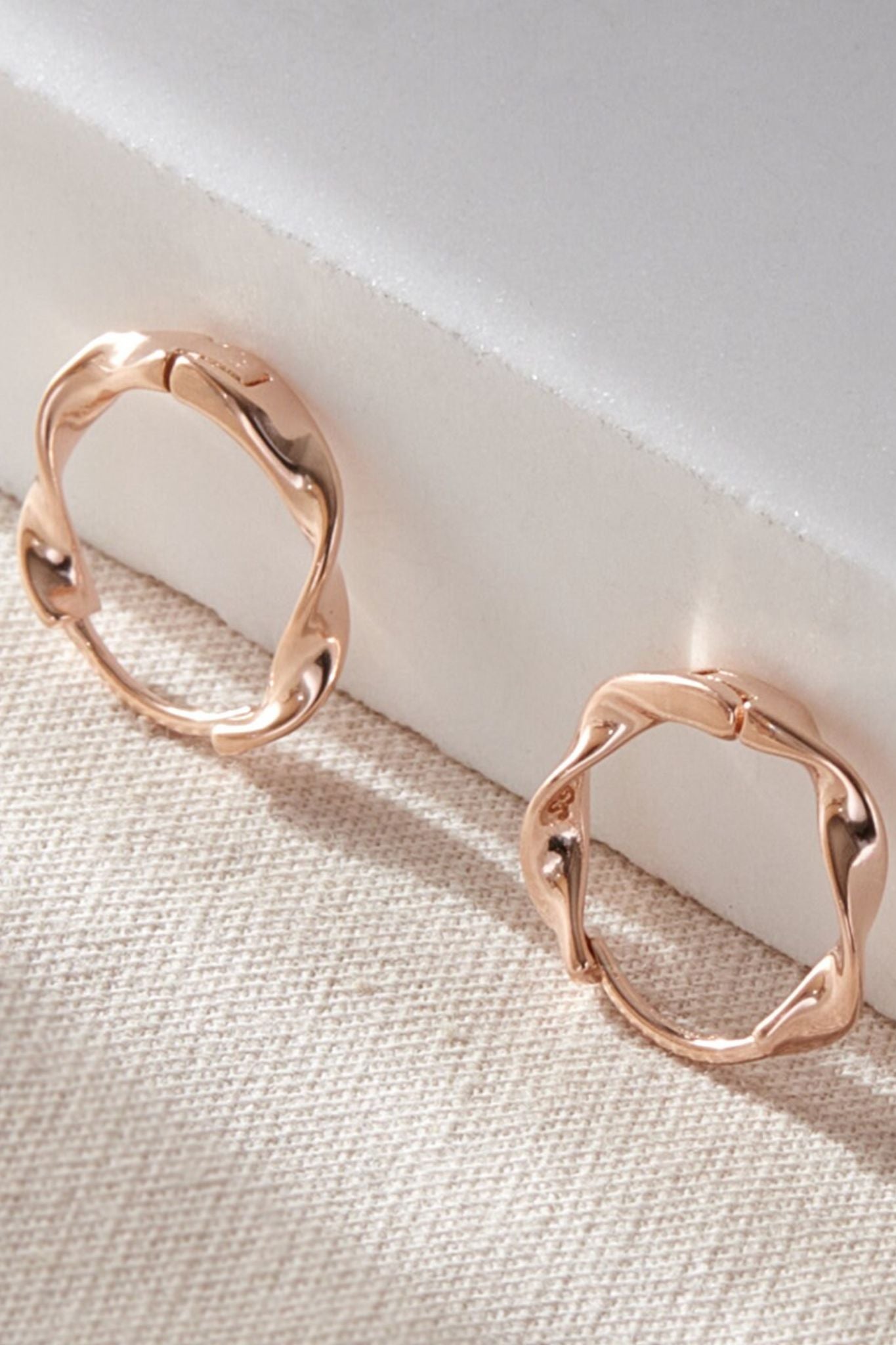 sterling-silver-minimalist-twist-hoops-in-rose-gold