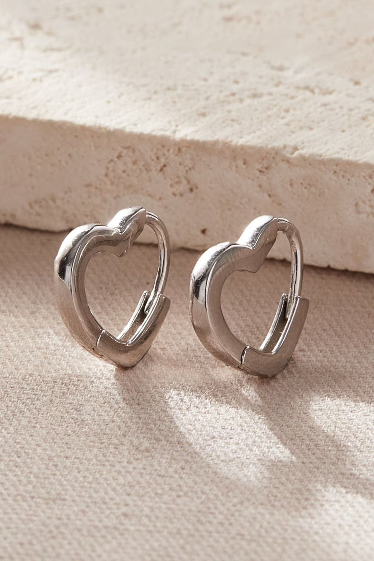 sterling-silver-heart-huggie-hoops-in-silver