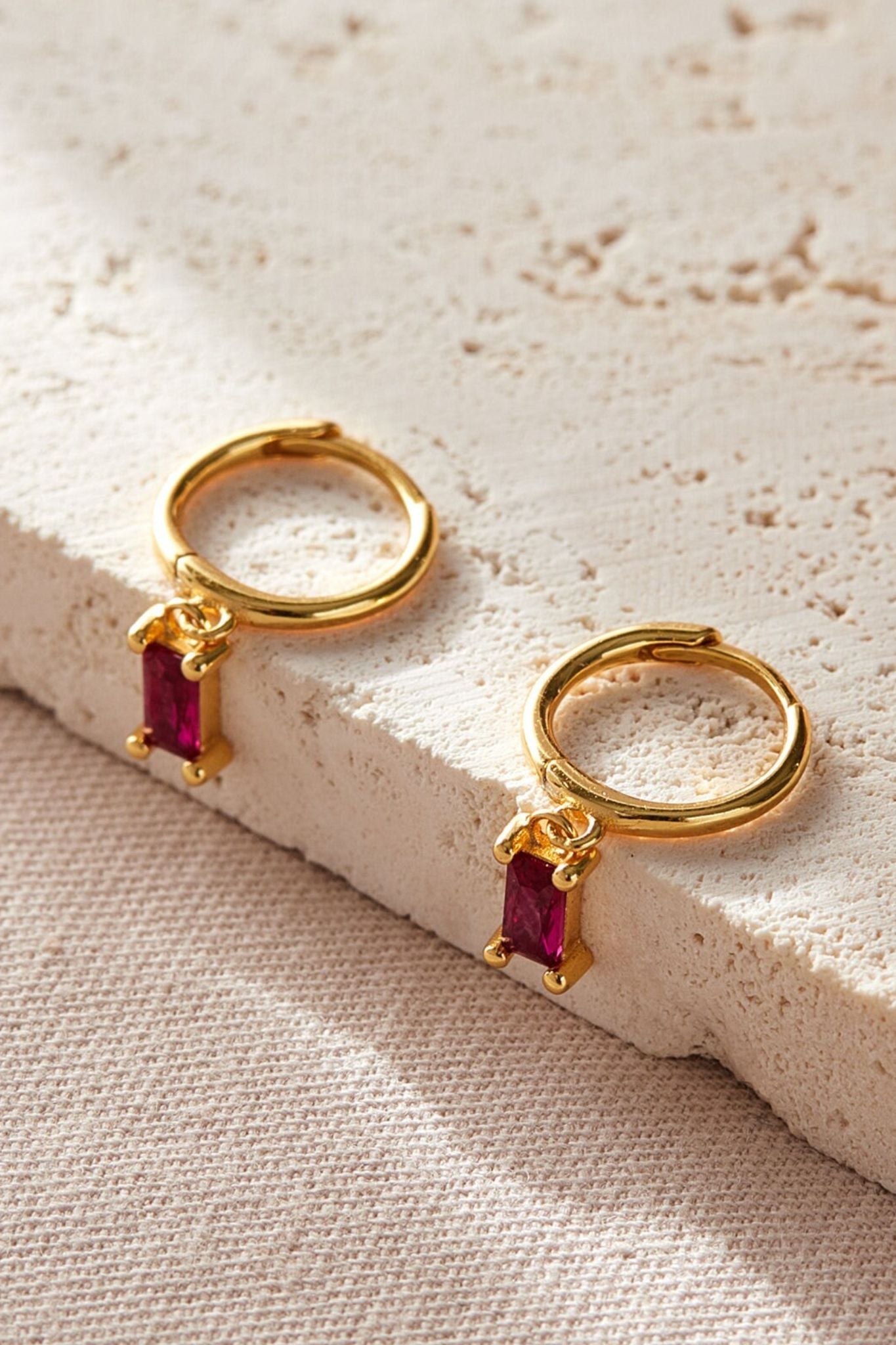 sterling-silver-cz-baguette-hoops-in-gold-pink