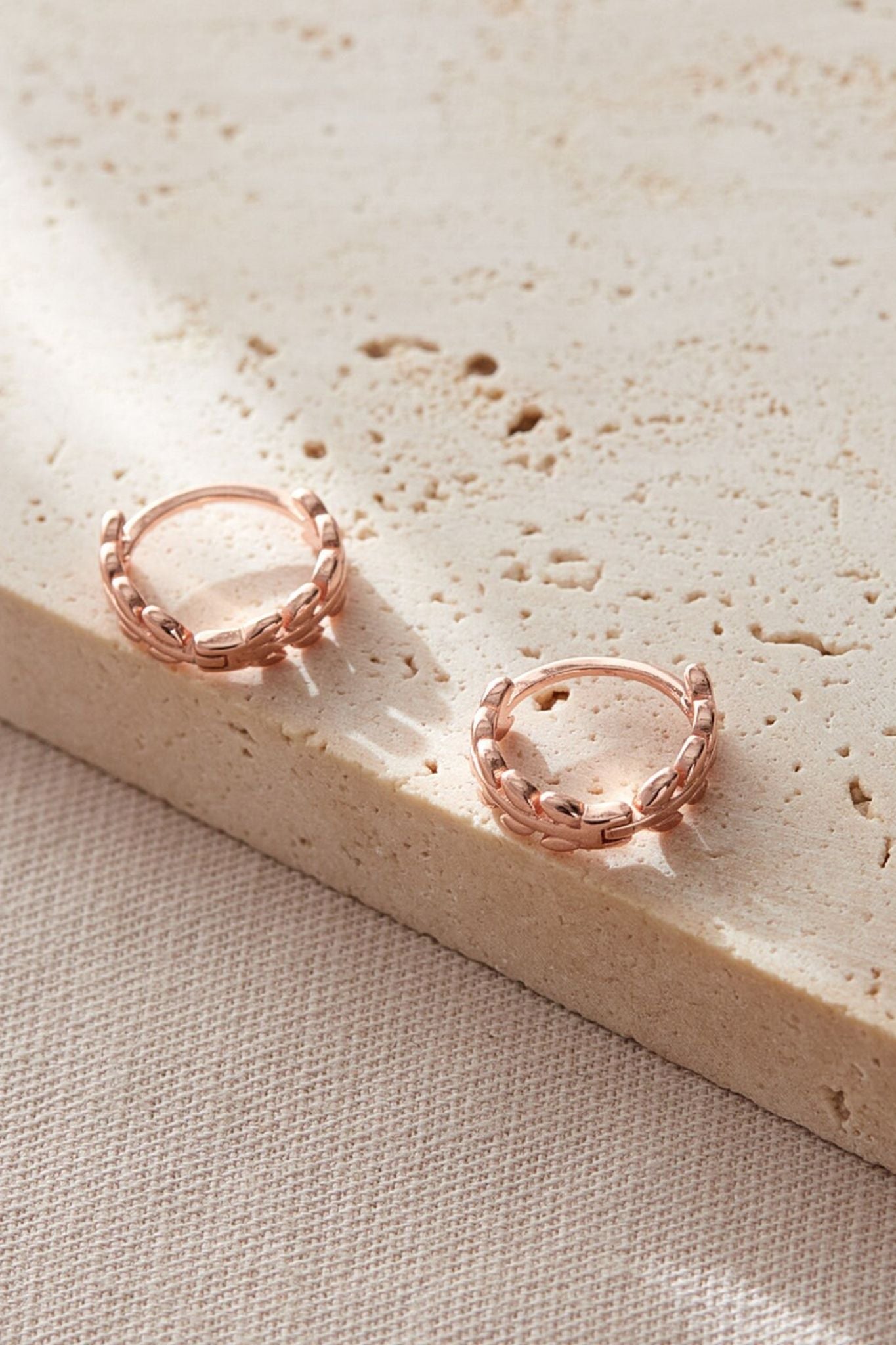 sterling-silver-olive-leaf-huggie-hoops-in-rose-gold