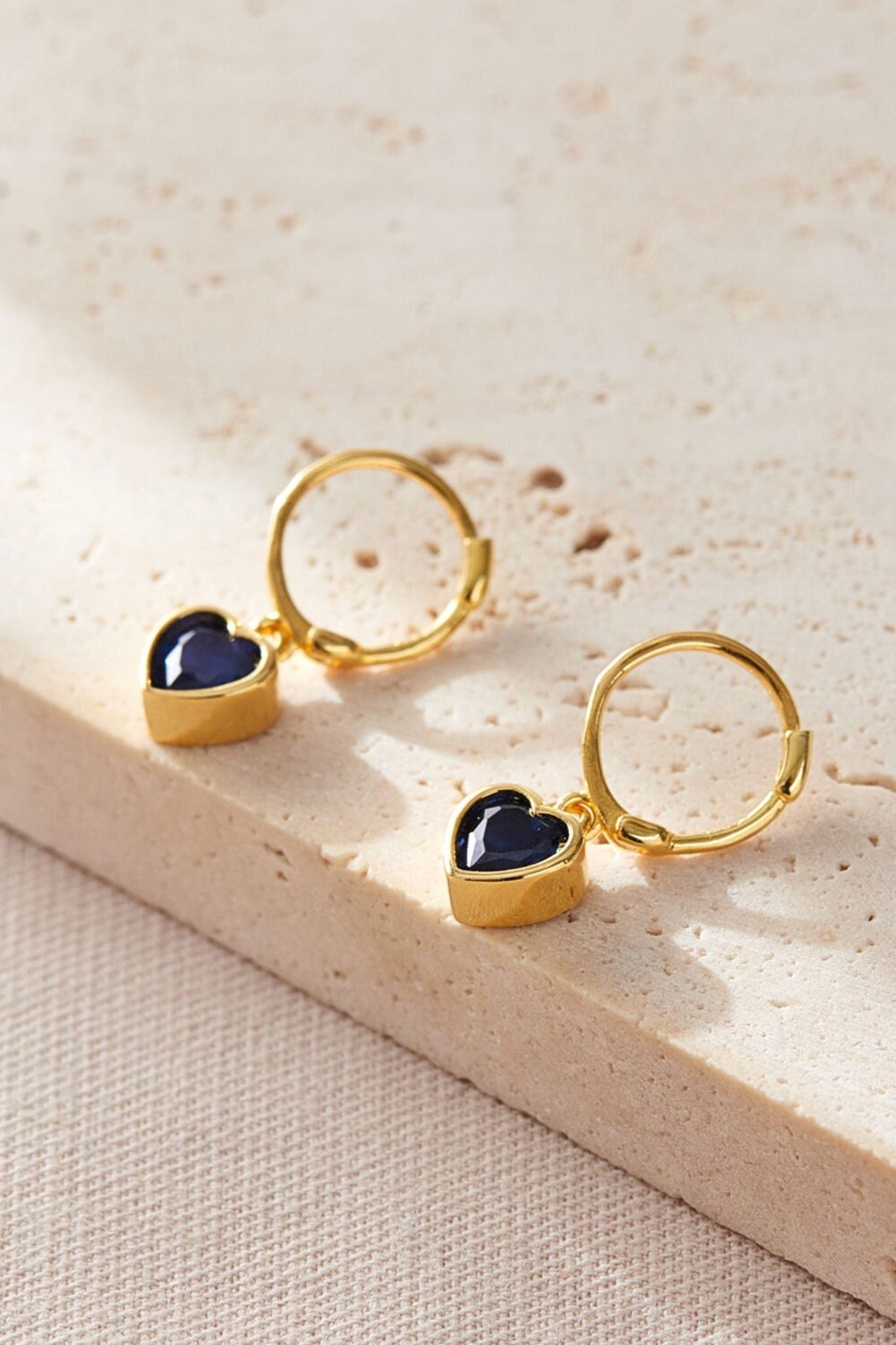 sterling-silver-cz-heart-hoops-in-gold-midnight-blue