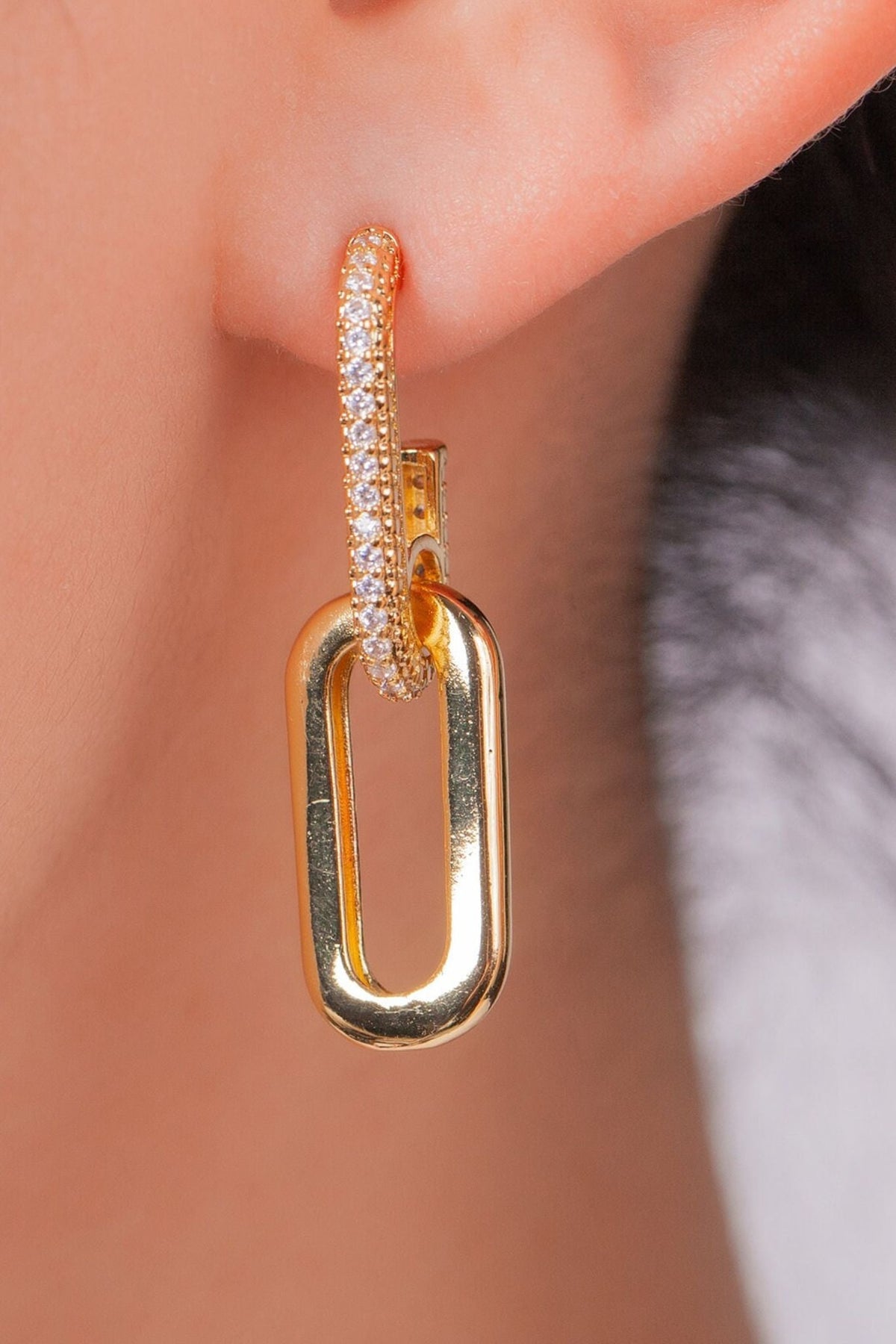close up of the gold colourway of this sparkly link dangle hoop earring