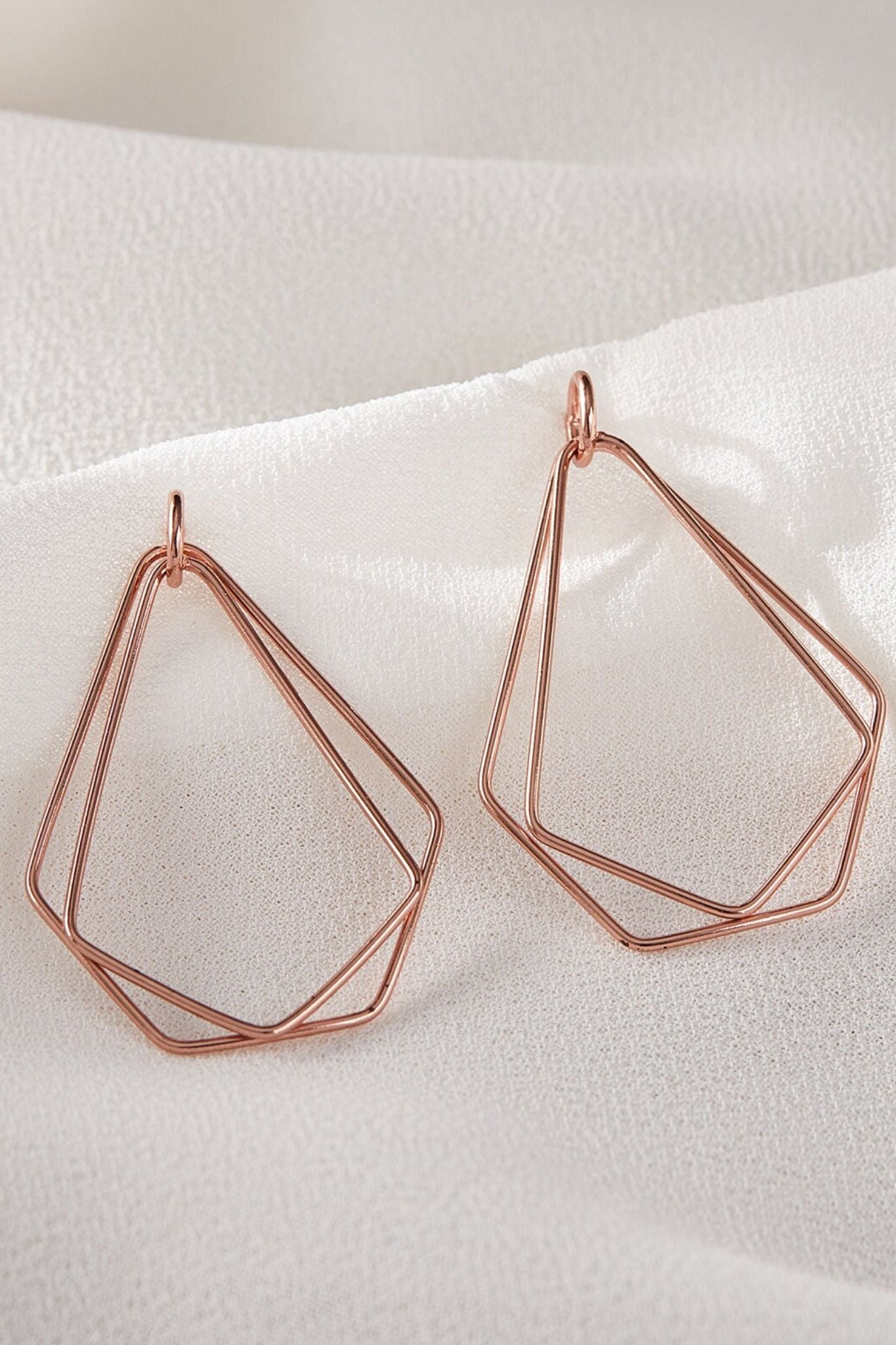sterling-silver-geometric-dangle-earrings-in-rose-gold-closeup