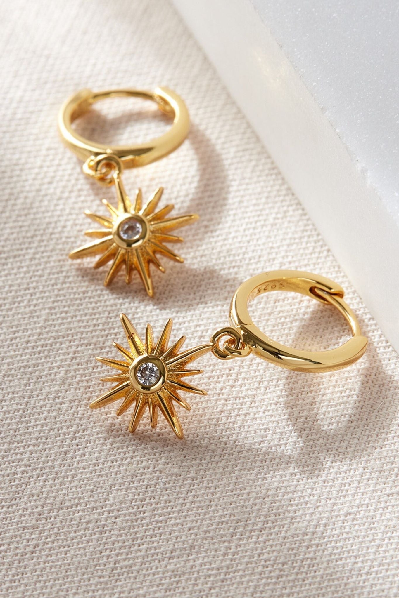 sterling-silver-north-star-hoops-in-gold-white