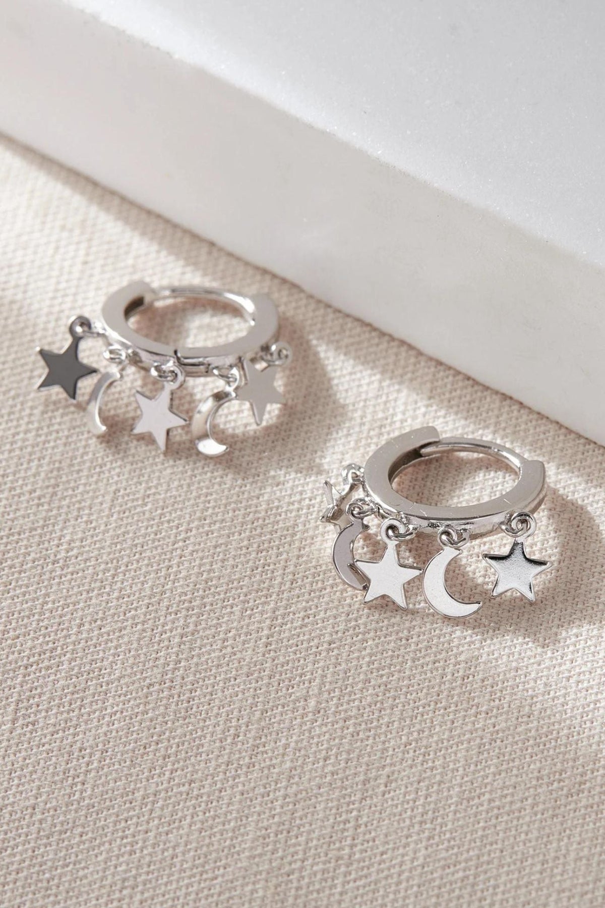 sterling-silver-star-moon-charm-hoops-in-silver