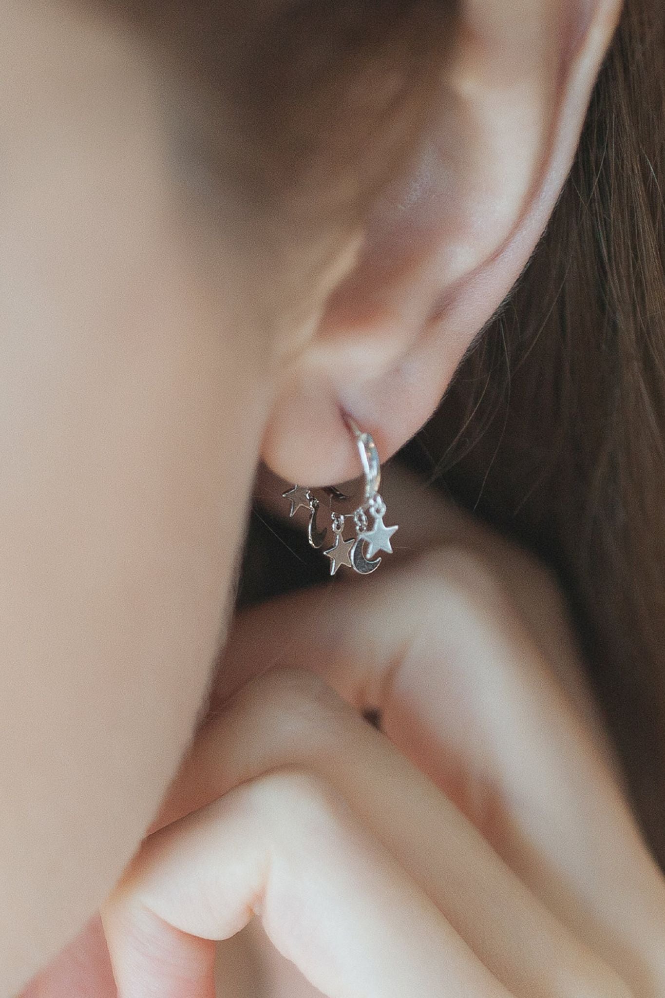 sterling-silver-star-moon-charm-hoops-in-silver-model