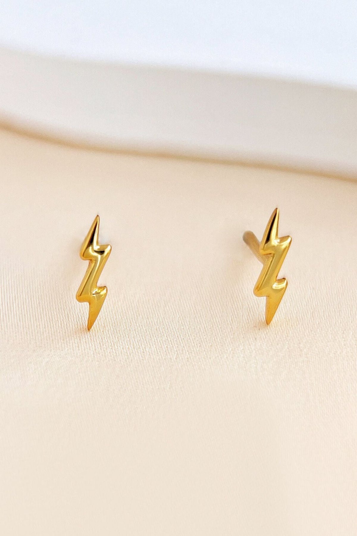 sterling-silver-lightning-bolt-studs-in-gold