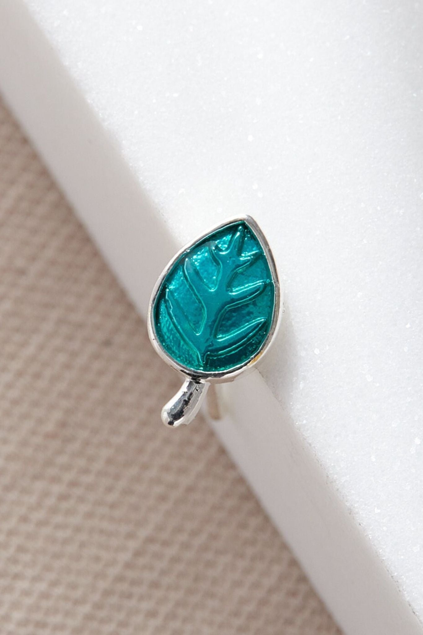 turquoise-leaf-stud-earrings-closeup-surface