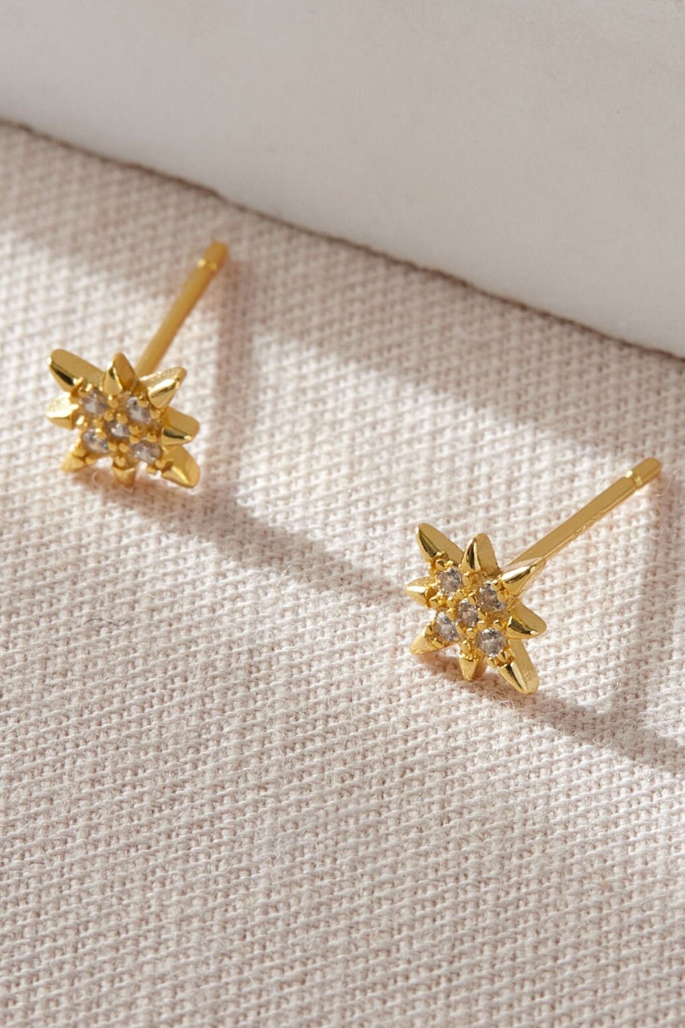 sterling-silver-cz-starburst-studs-in-gold-1
