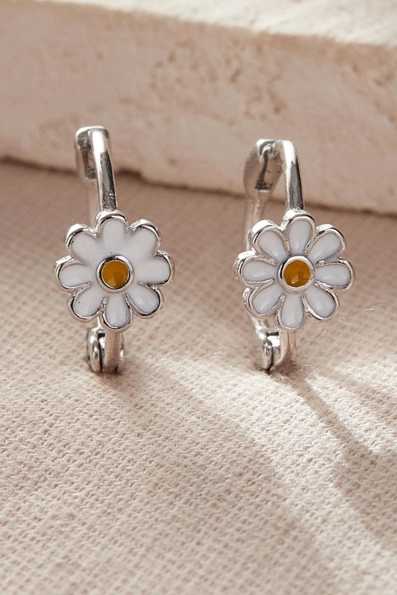 sterling-silver-daisy-flower-hoops-in-silver-closeup