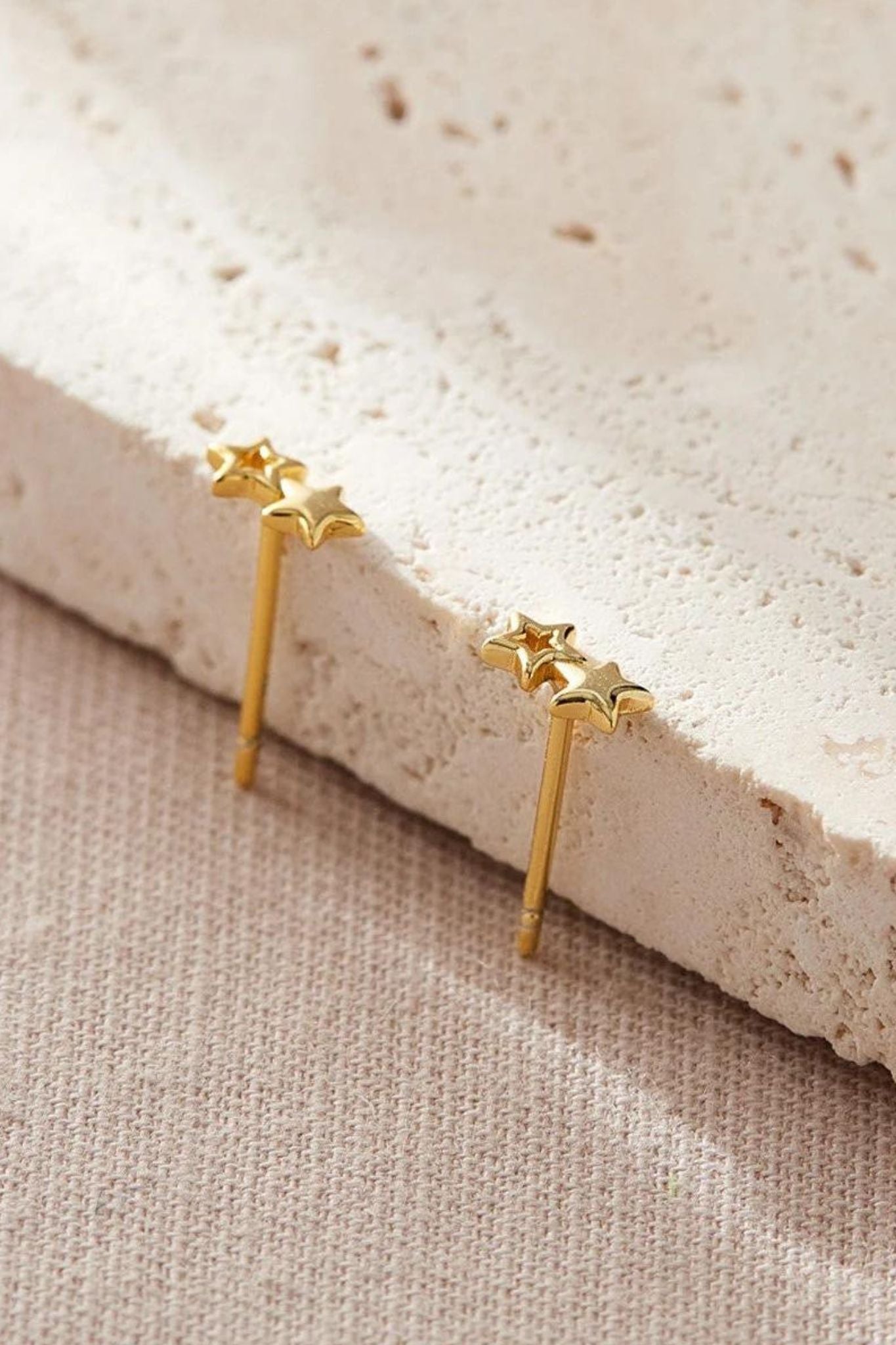 sterling-silver-double-star-studs-6mm-in-gold-closeup 