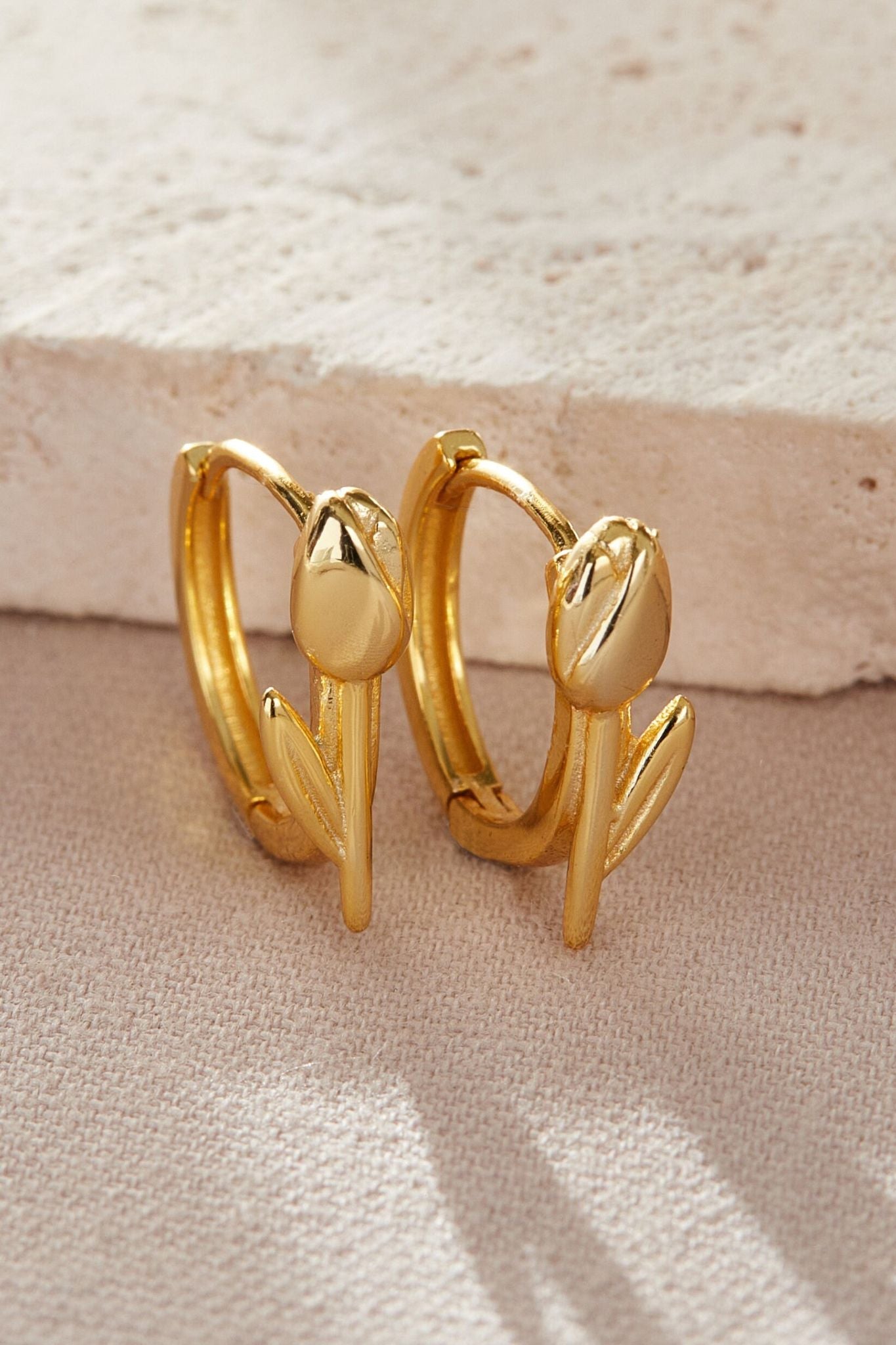 sterling-silver-tulip-hoops-in-gold-closeup