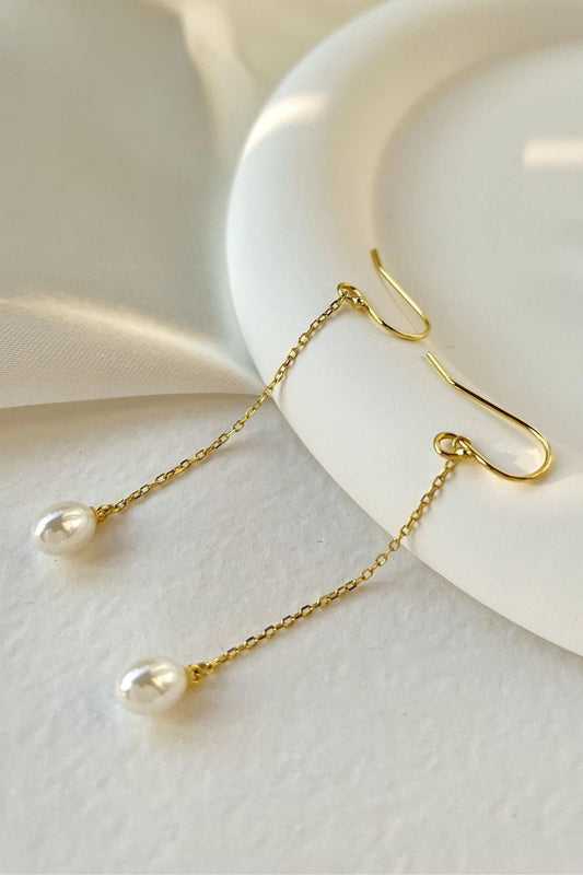 sterling-silver-pearl-drop-earrings-in-gold-closeup