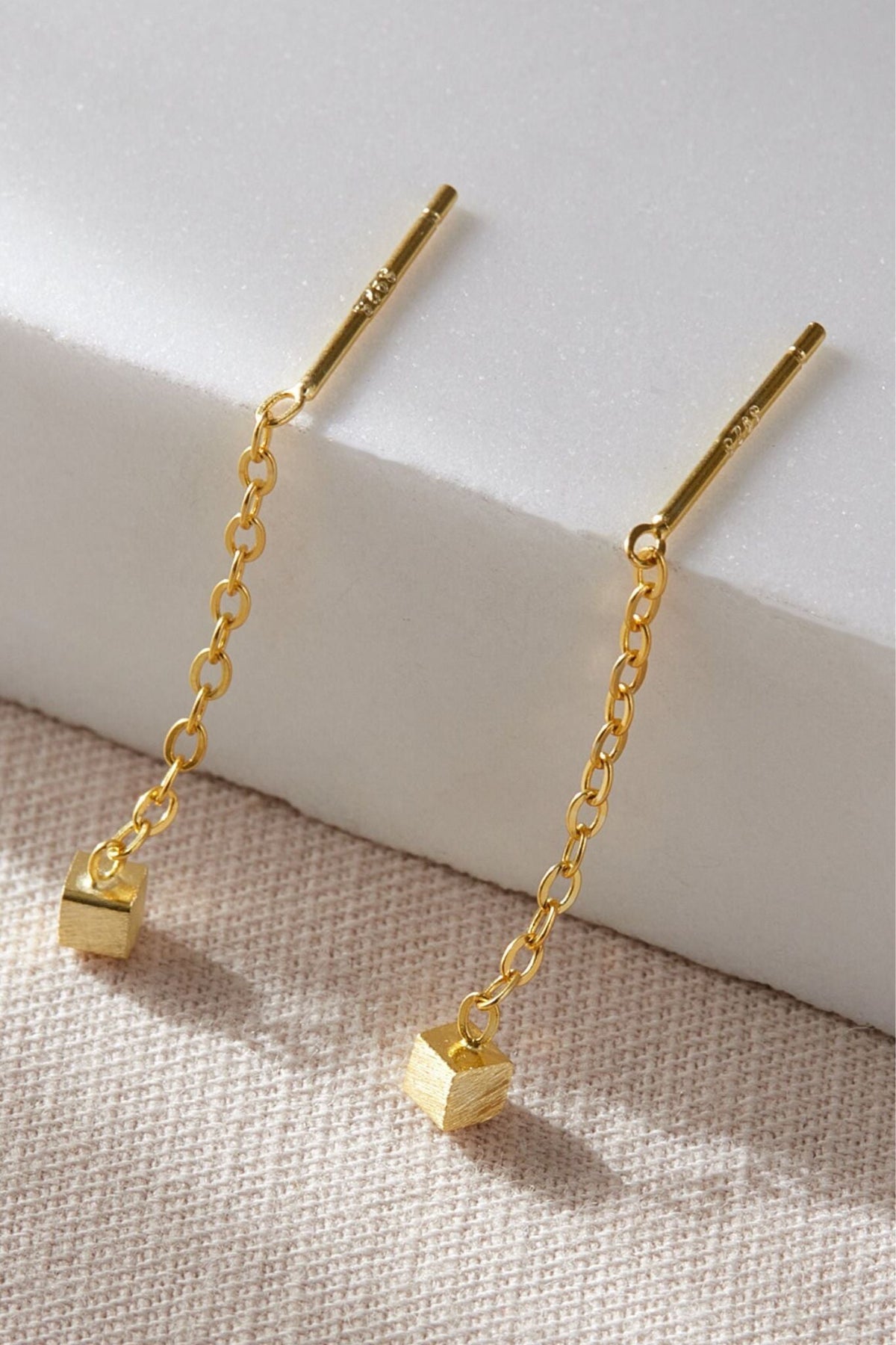 sterling-silver-geometric-threader-earrings-in-gold-closeup