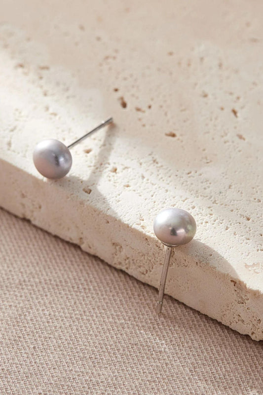 sterling-silver-pearl-studs-in-silver-closeup