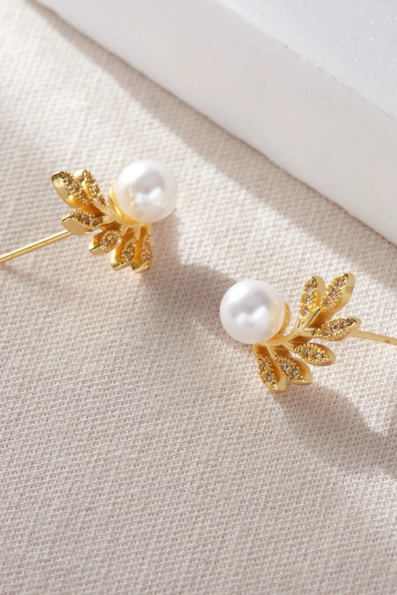 sparkly-leaf-pearl-studs-closeup