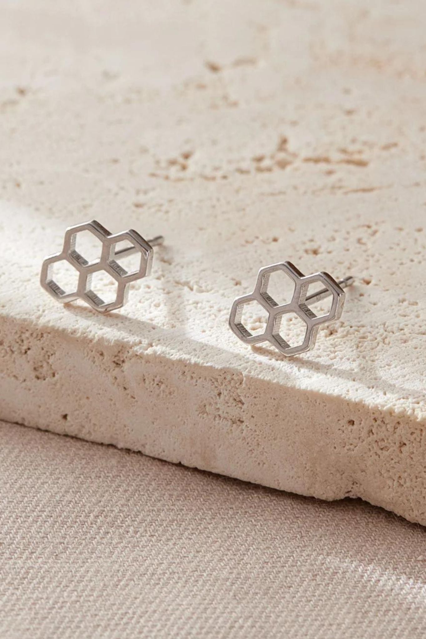 close up of the silver honeycomb stud earrings