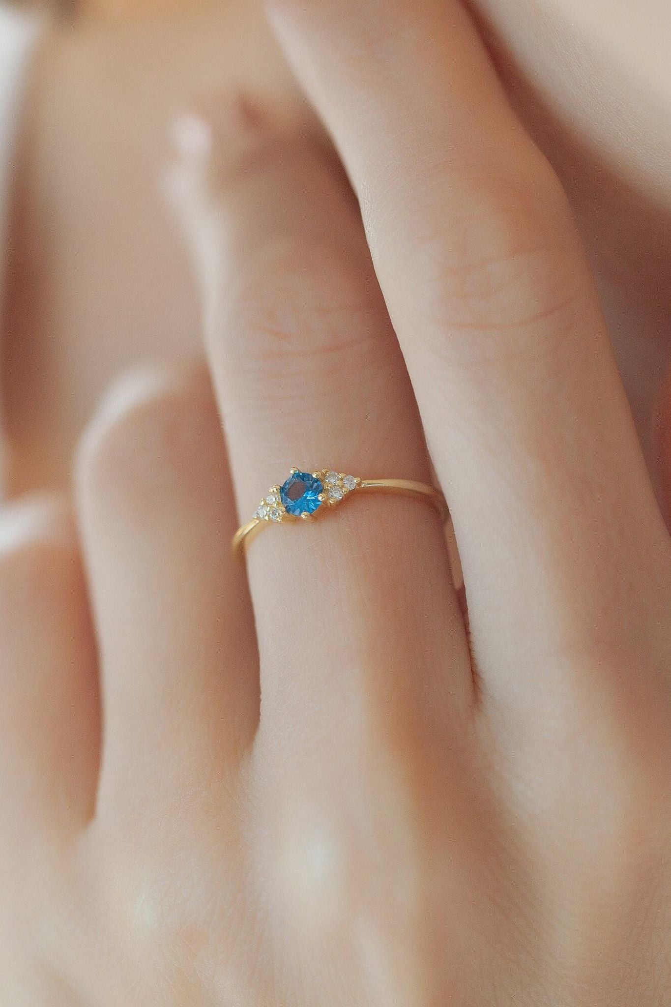 sterling-silver-cz-blue-sparkly-ring-model-hand