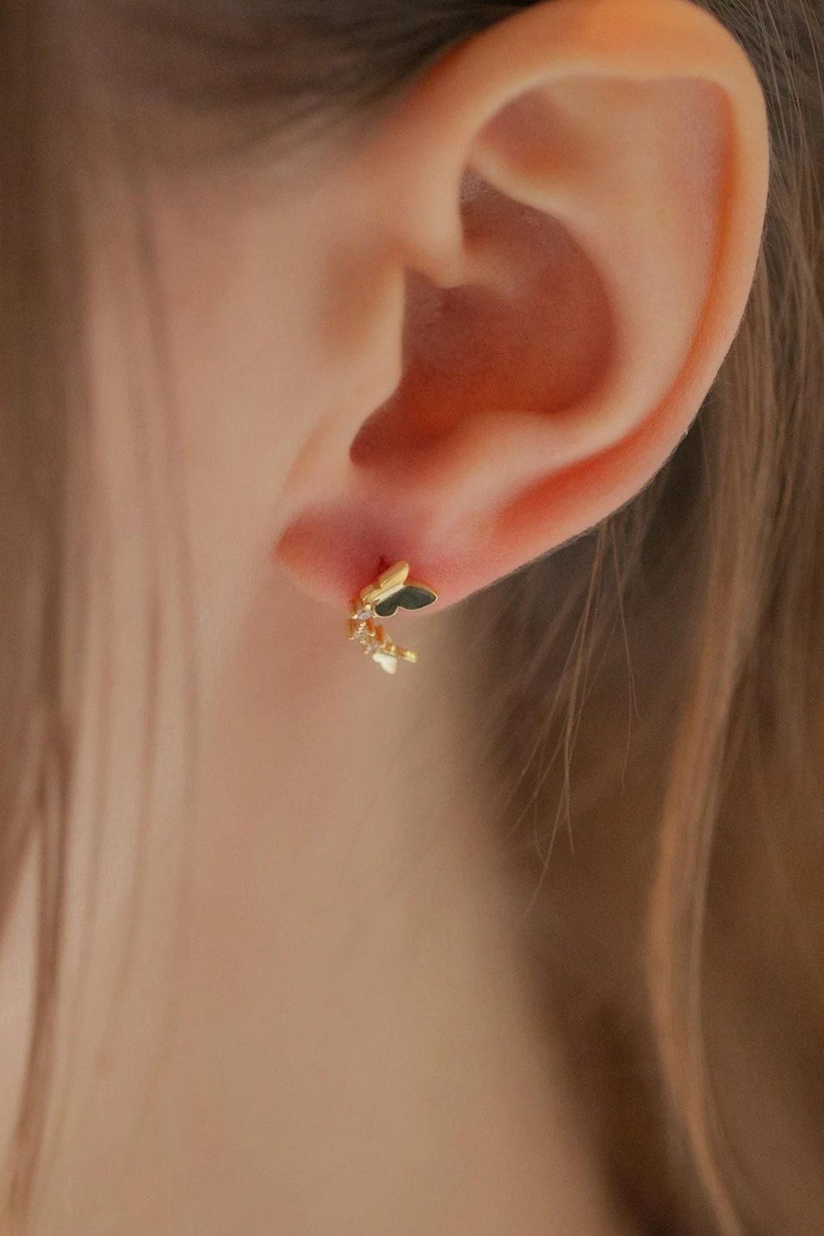 sterling-silver-cz-dual-butterfly-studs-in-gold-model
