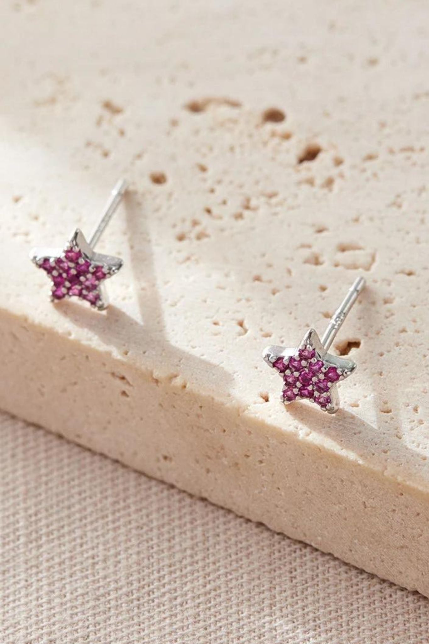 sterling-silver-sparkly-star-studs-in-silver-fuchsia