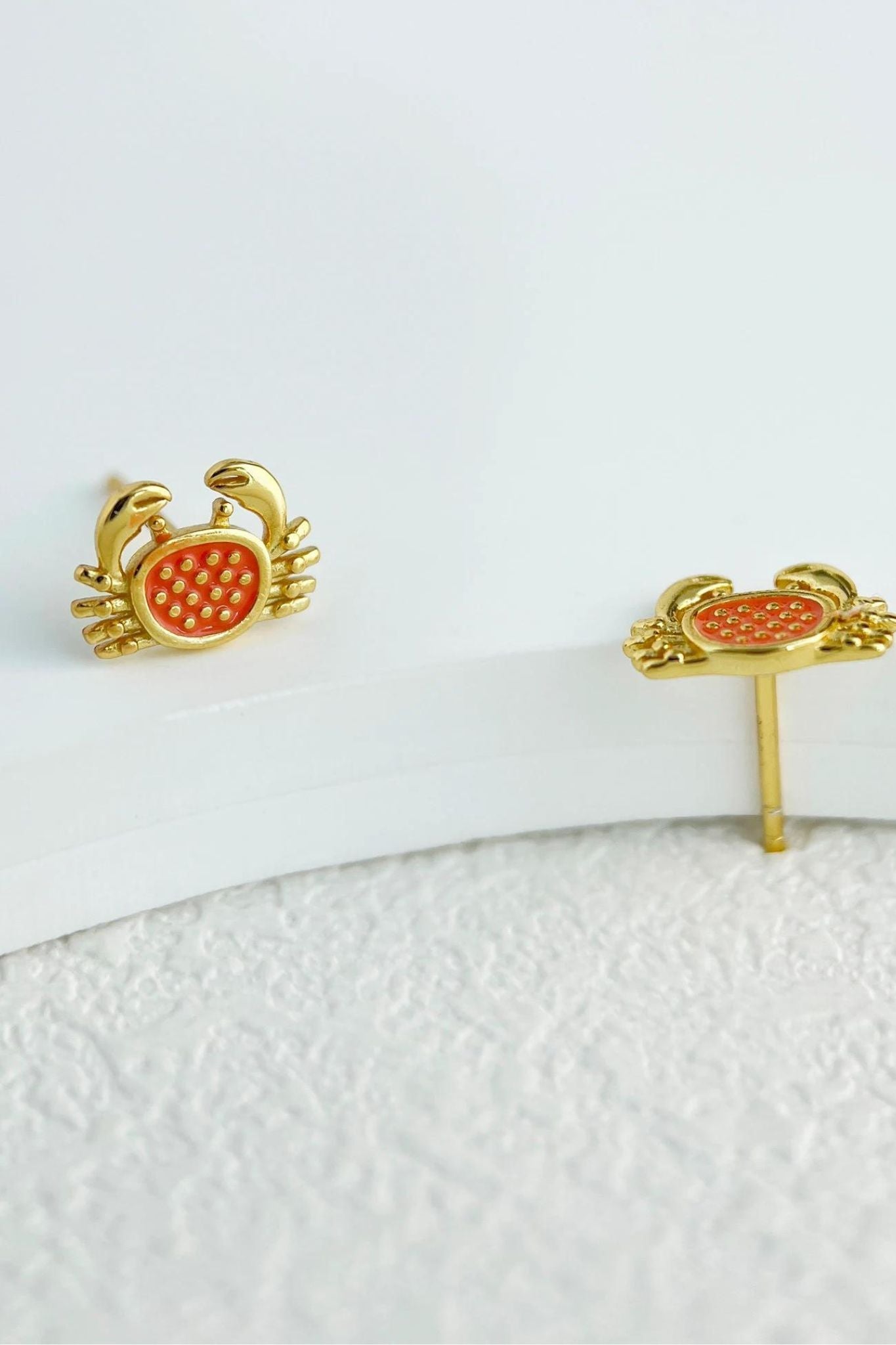 sterling-silver-crab-studs-in-gold-closeup
