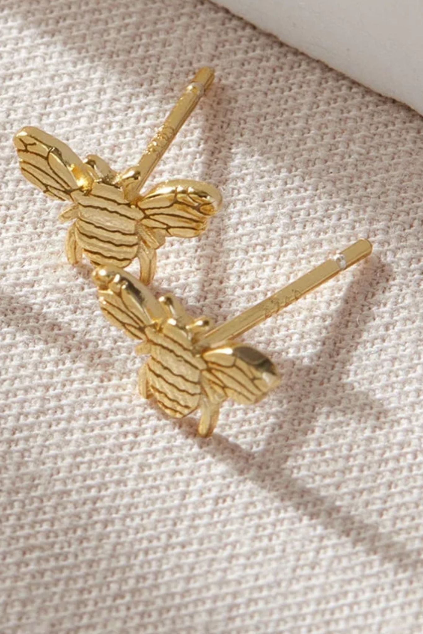 sterling-silver-bee-studs-in-gold-closeup