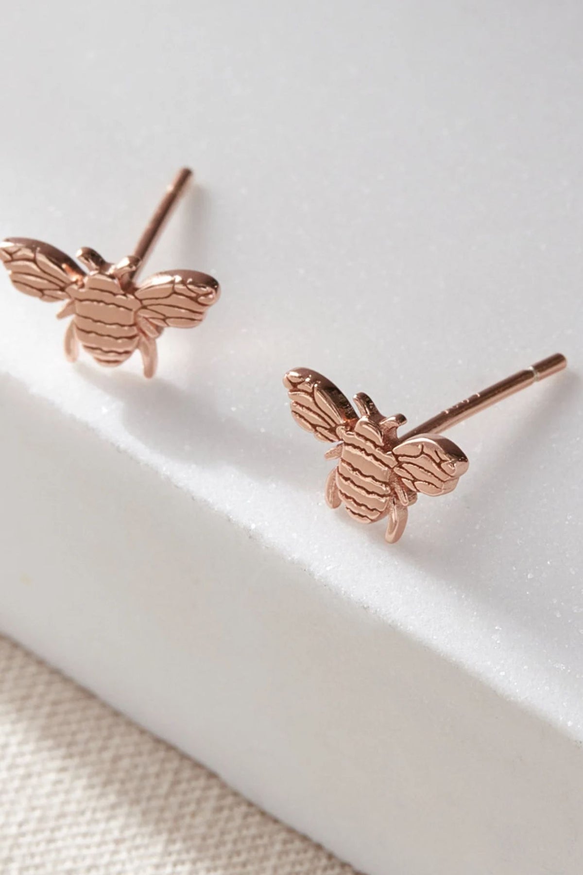 sterling-silver-bee-studs-in-rose-gold-closeup