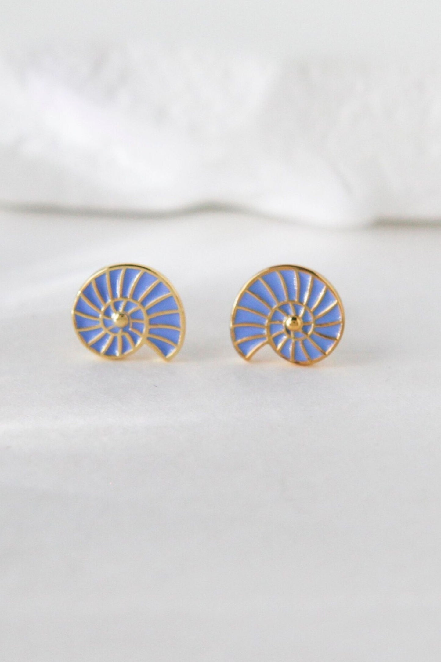 sterling-silver-sea-shell-studs-in-gold-closeup