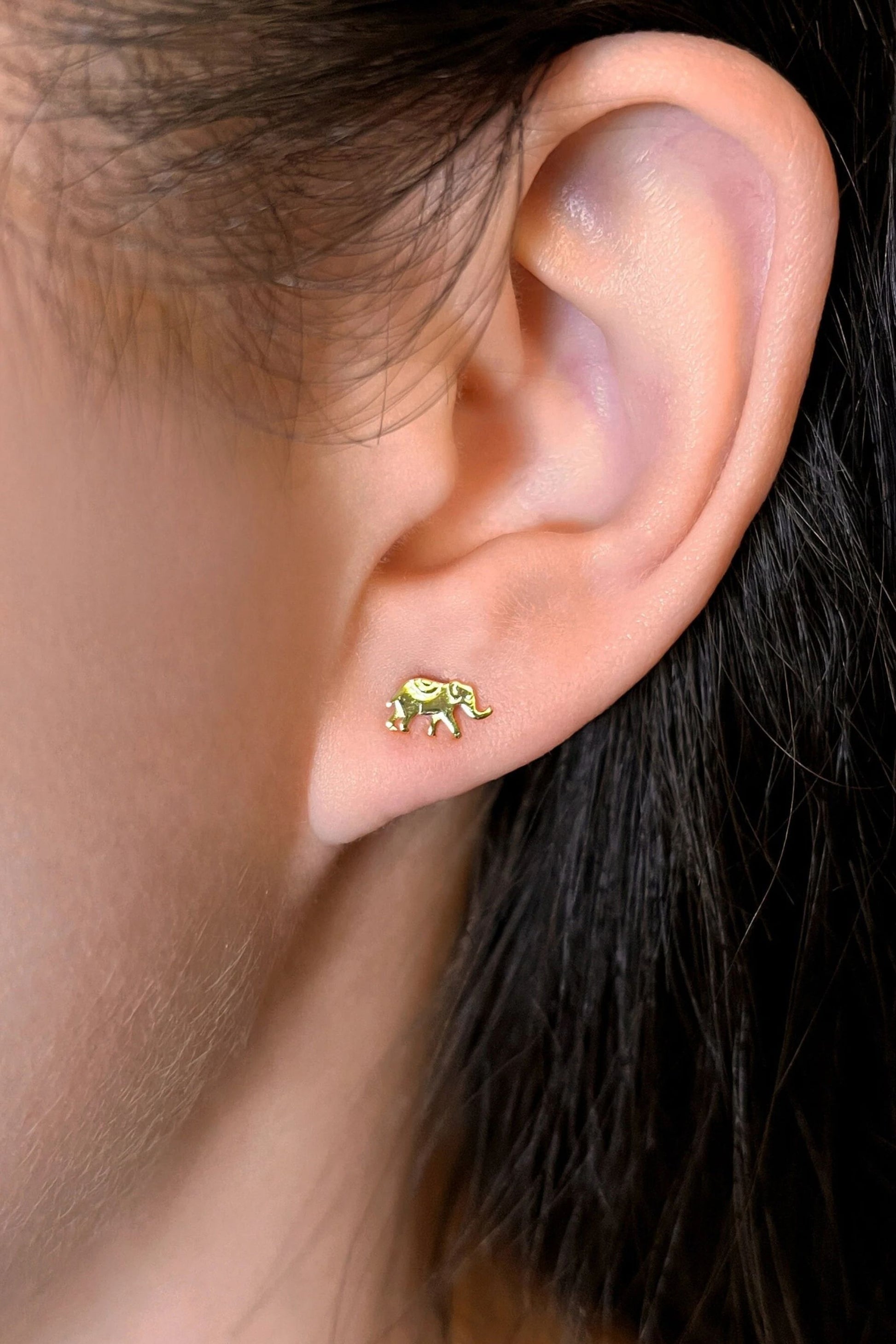 sterling-silver-tiny-elephant-studs-in-gold-model