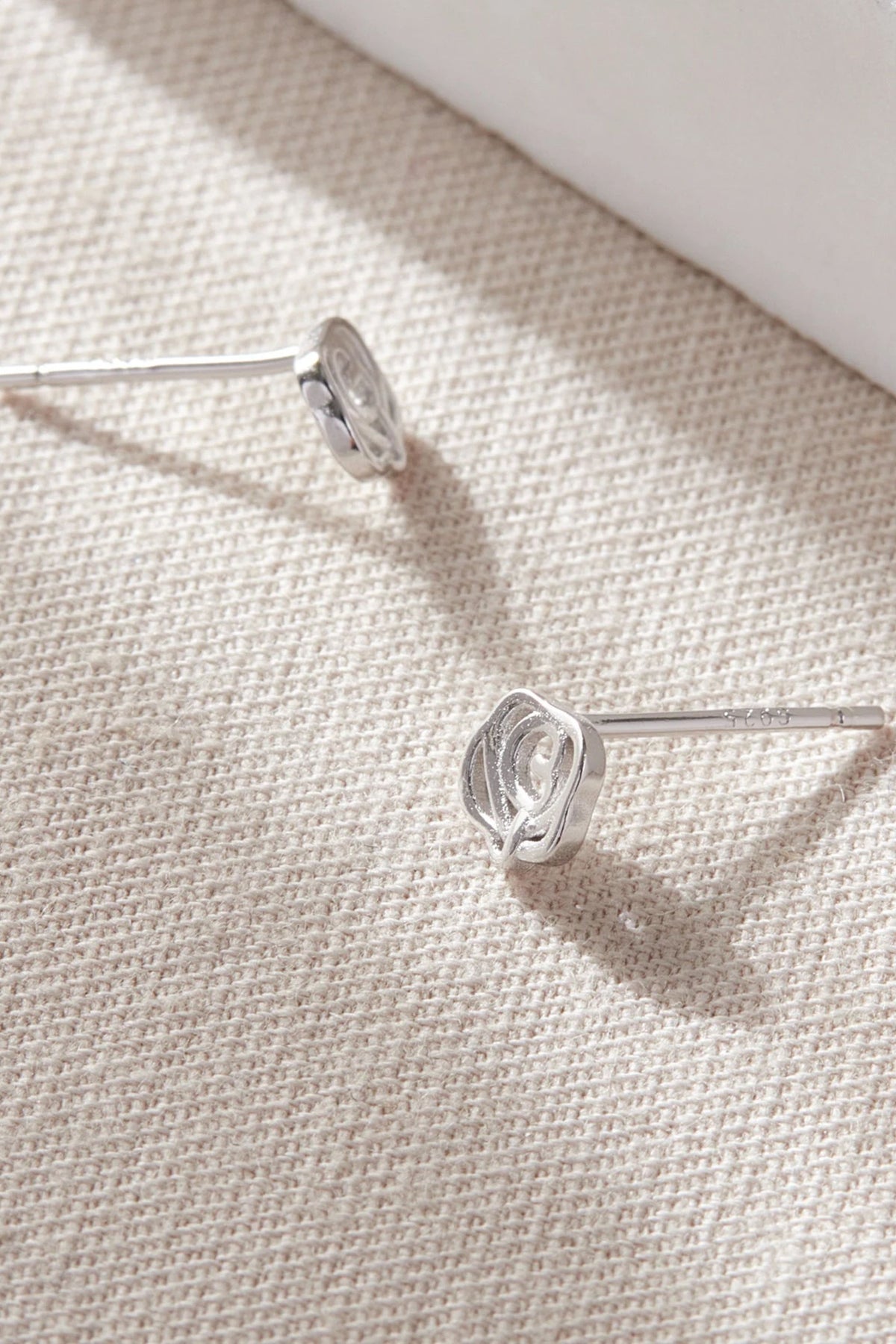sterling-silver-rose-floral-studs-in-silver-closeup