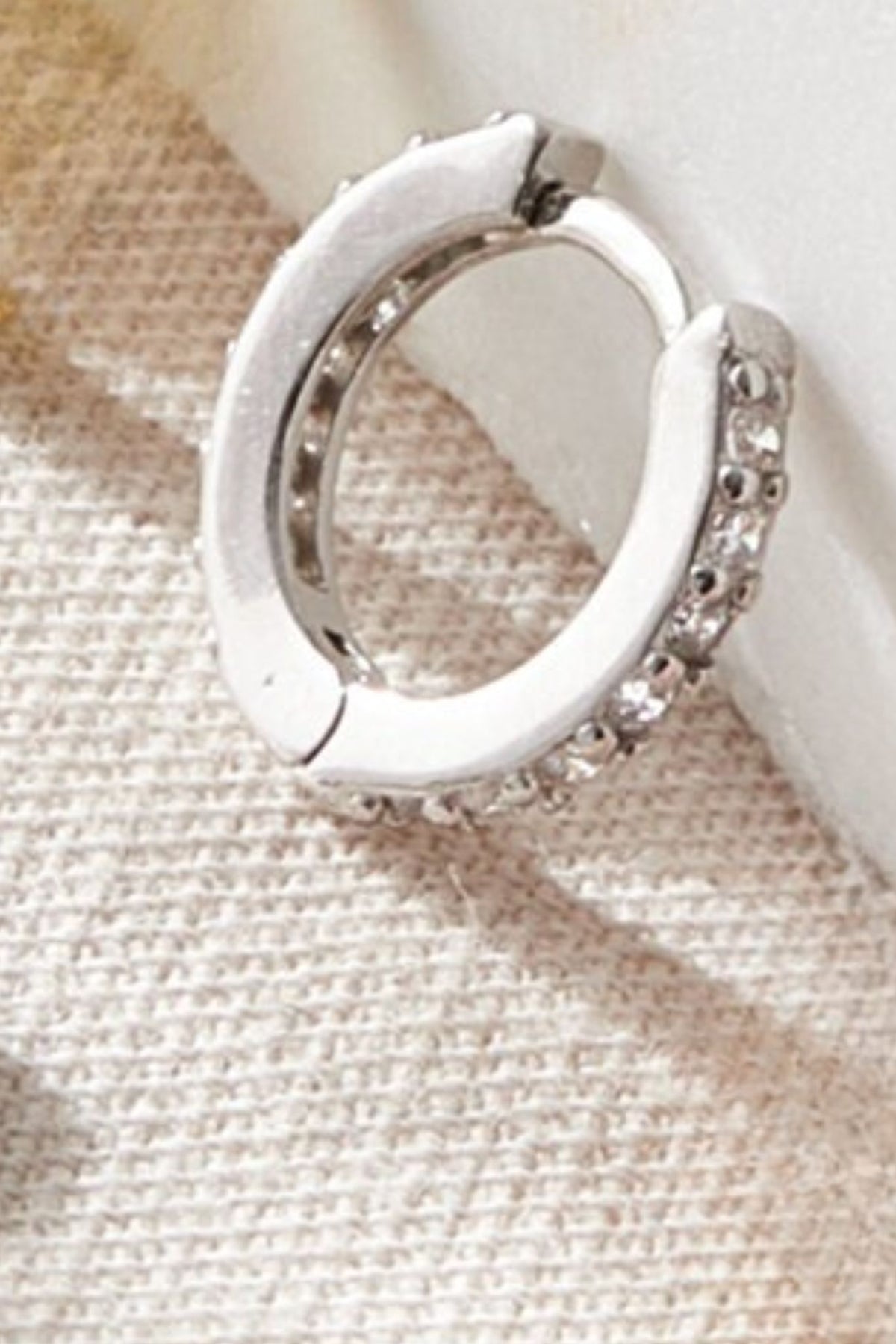 sterling-silver-cz-huggie-hoops-in-silver-white-closeup