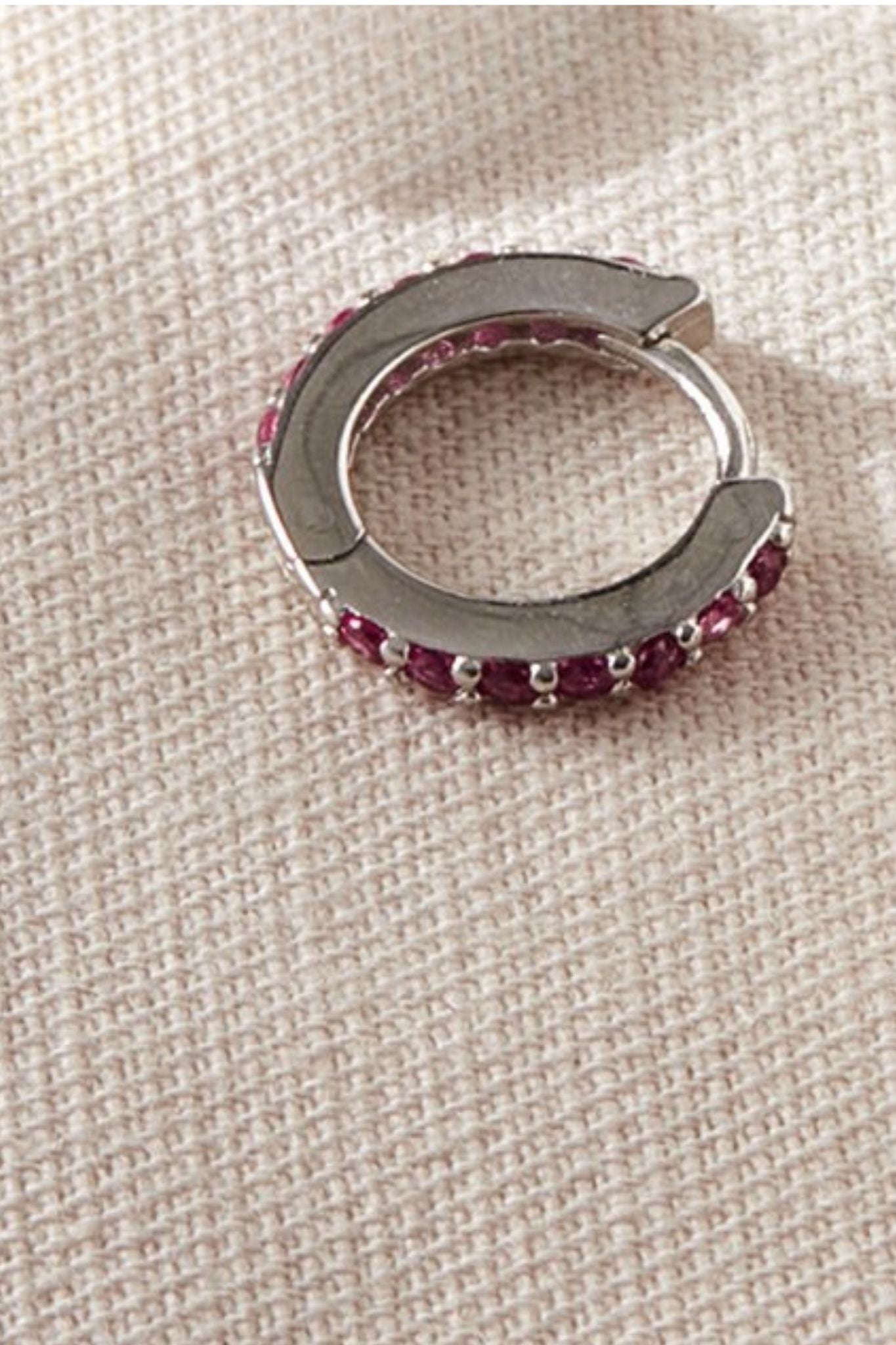 sterling-silver-cz-huggie-hoops-in-silver-pink-closeup