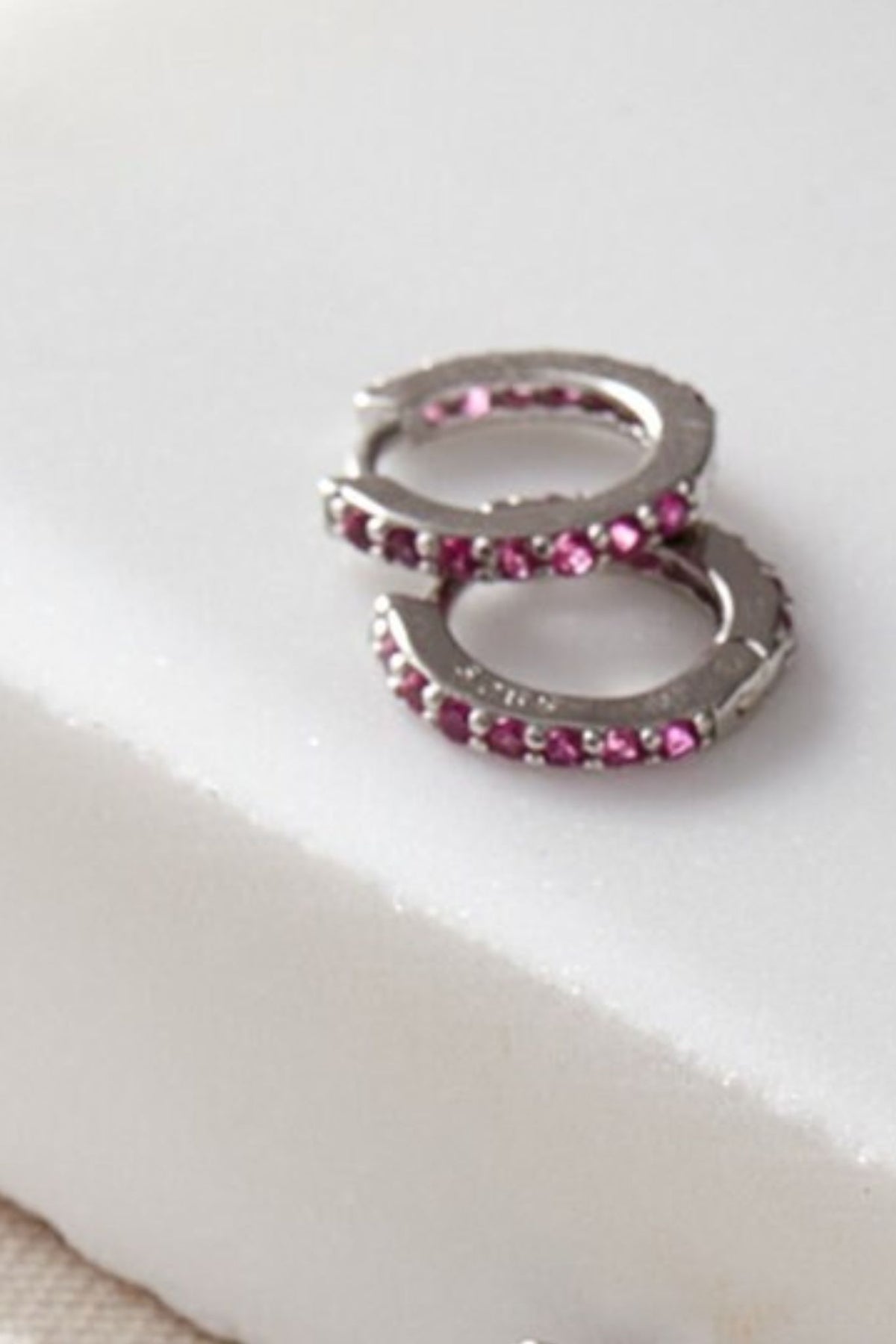 sterling-silver-cz-huggie-hoops-in-silver-pink