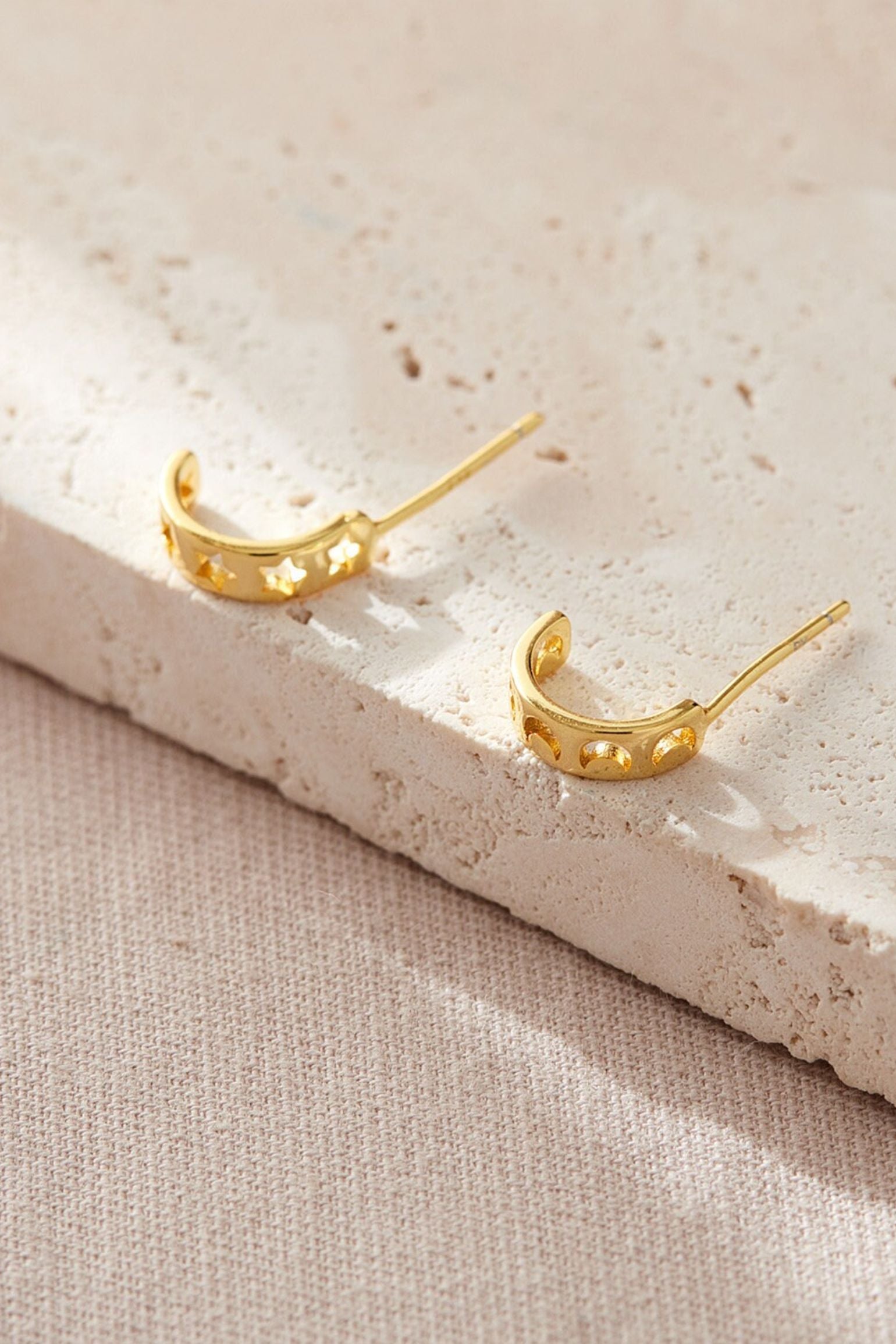 sterling-silver-mismatched-star-moon-half-hoops-in-gold-flat