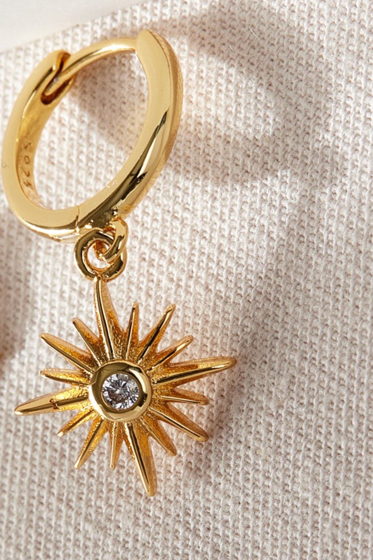 sterling-silver-north-star-hoops-in-gold-white-closeup