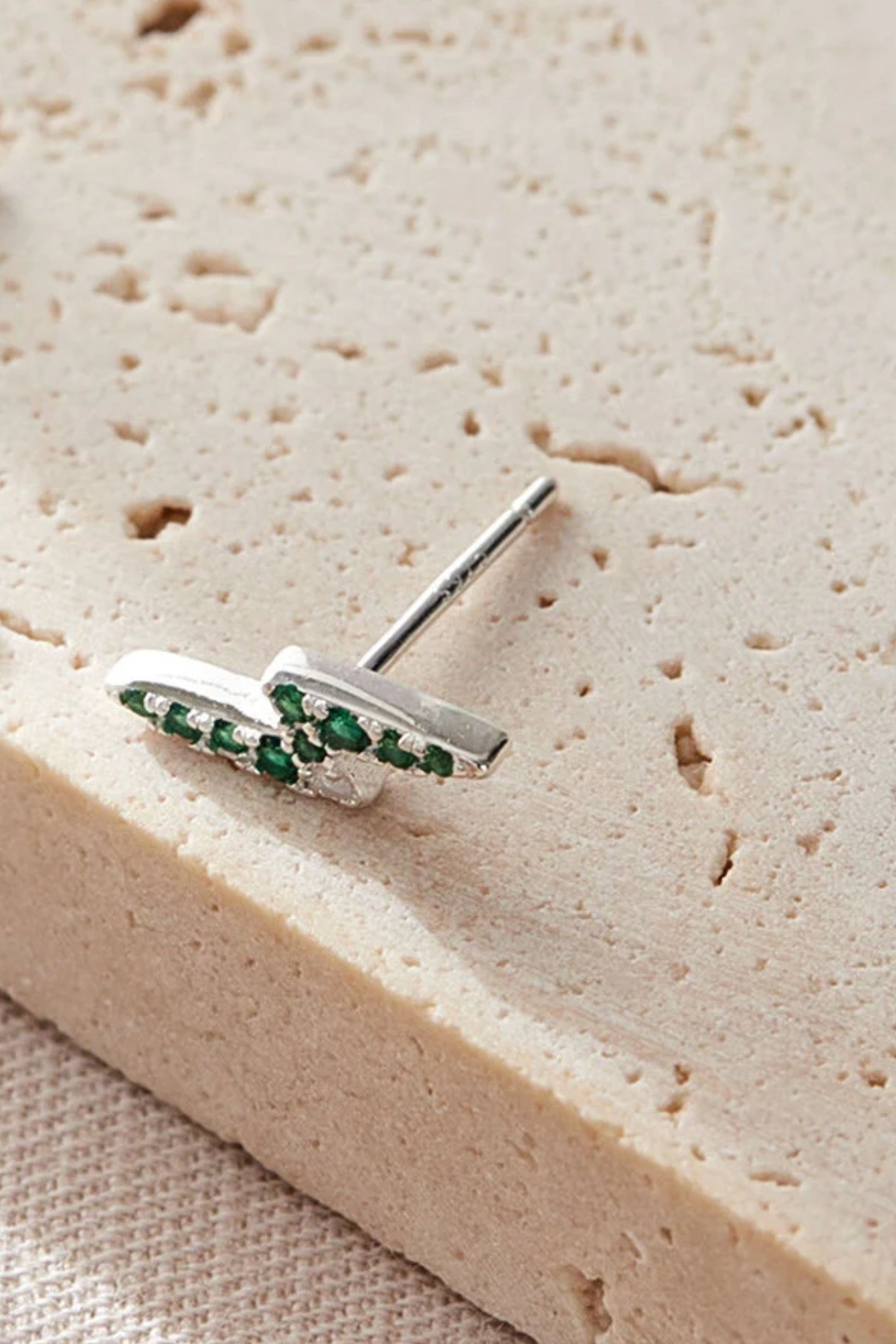 terling-silver-cz-lightning-bolt-studs-in-silver-green-closeup