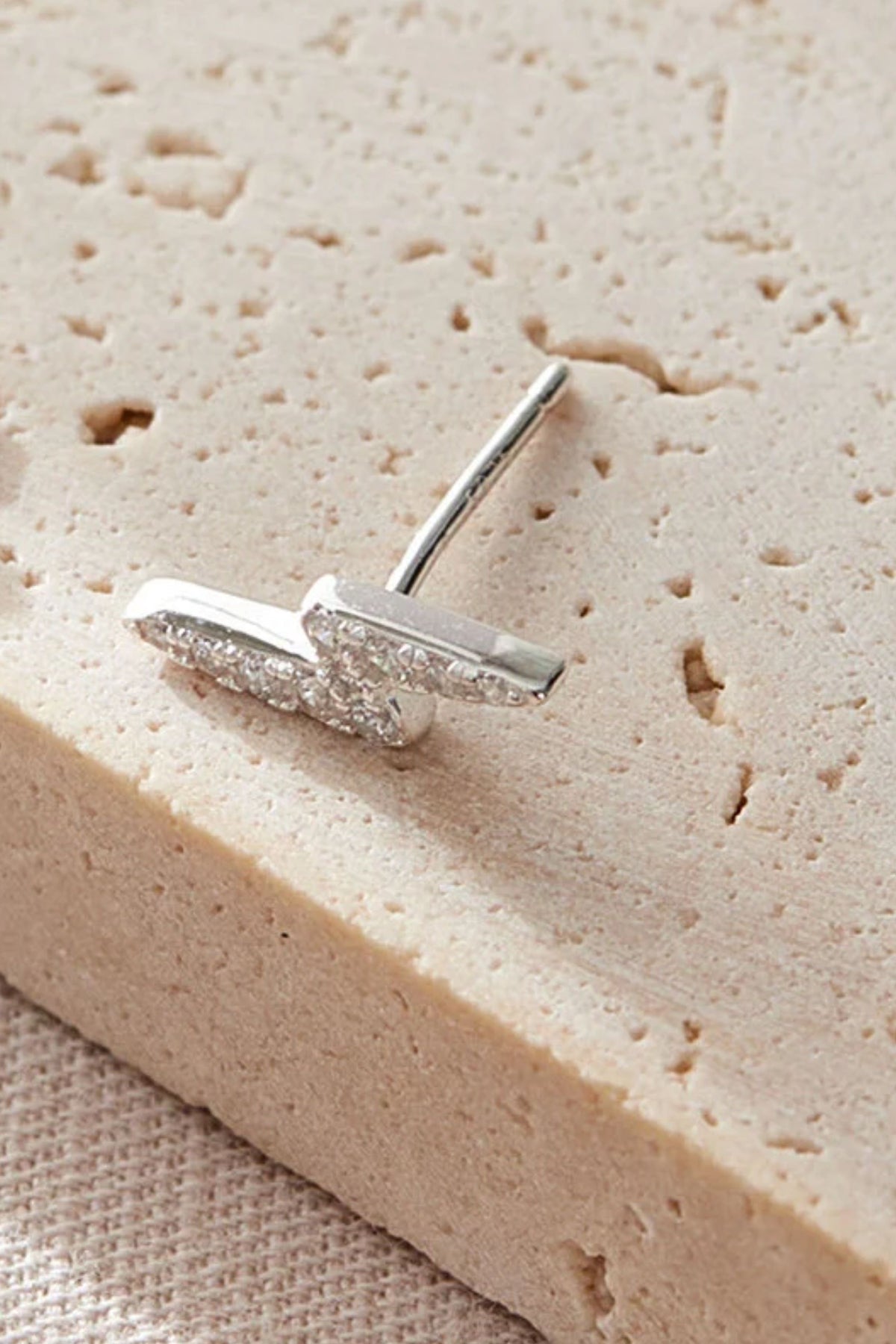 sterling-silver-cz-lightning-bolt-studs-in-silver-white-closeup
