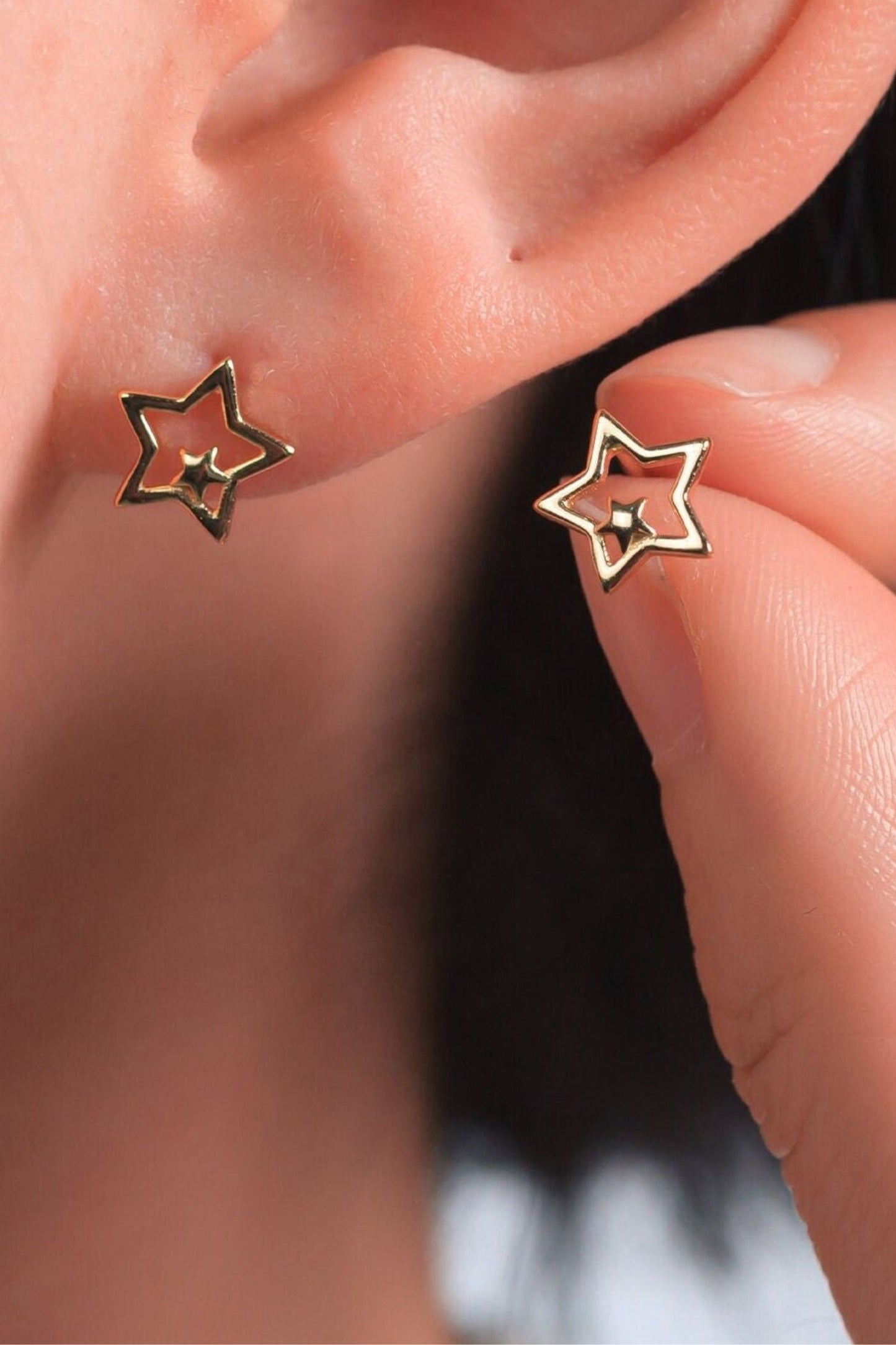 sterling-silver-openwork-dual-star-studs-in-gold-model