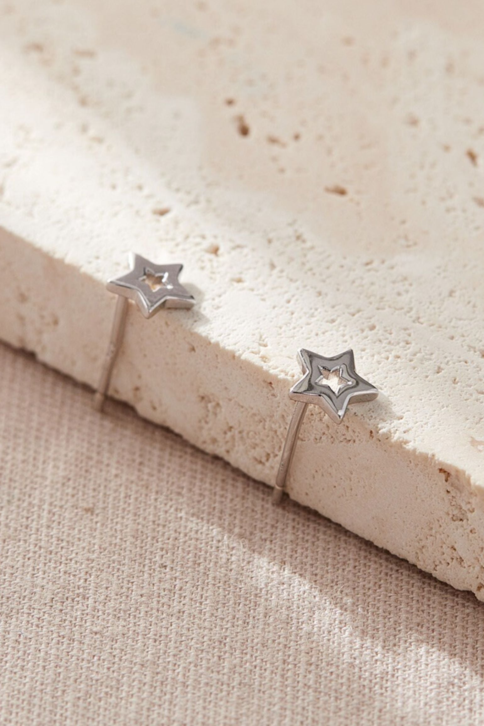 sterling-silver-openwork-star-studs-in-silver-closeup