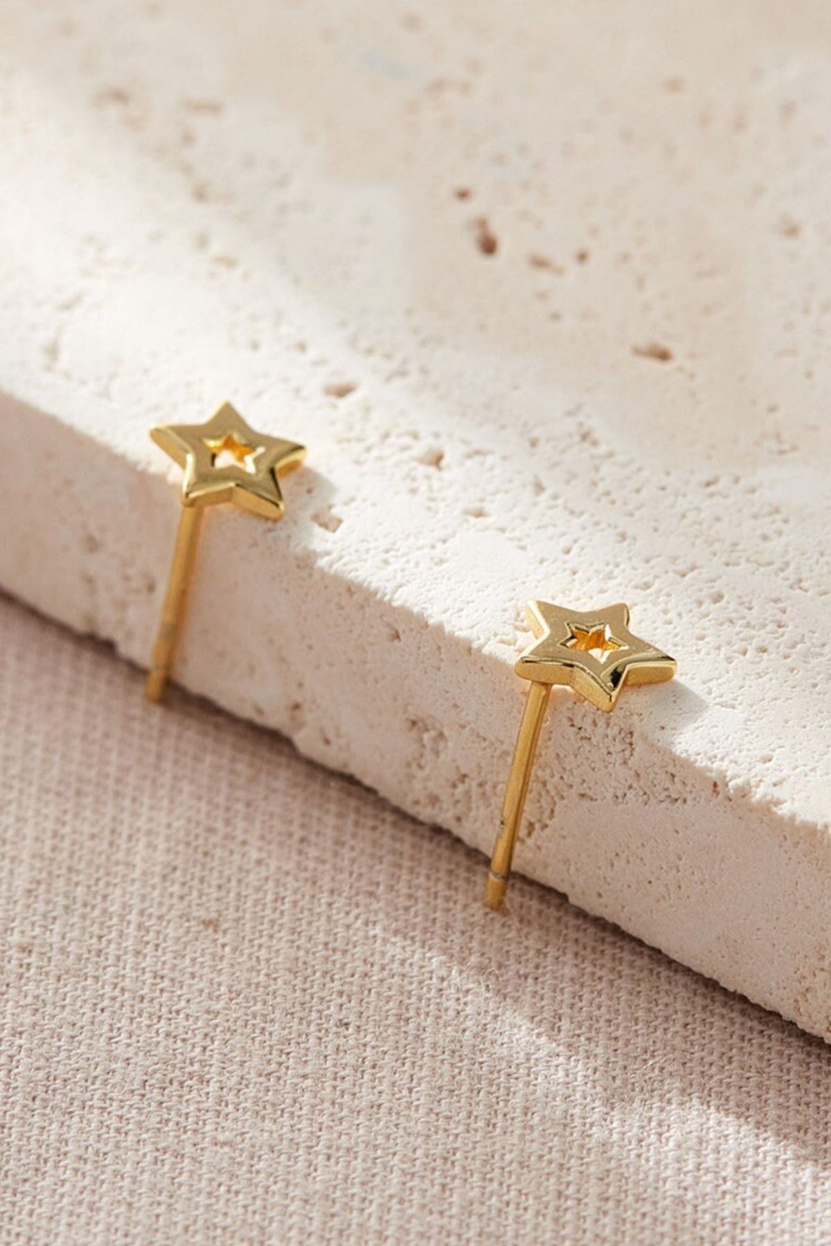 sterling-silver-openwork-star-studs-in-gold-closeup