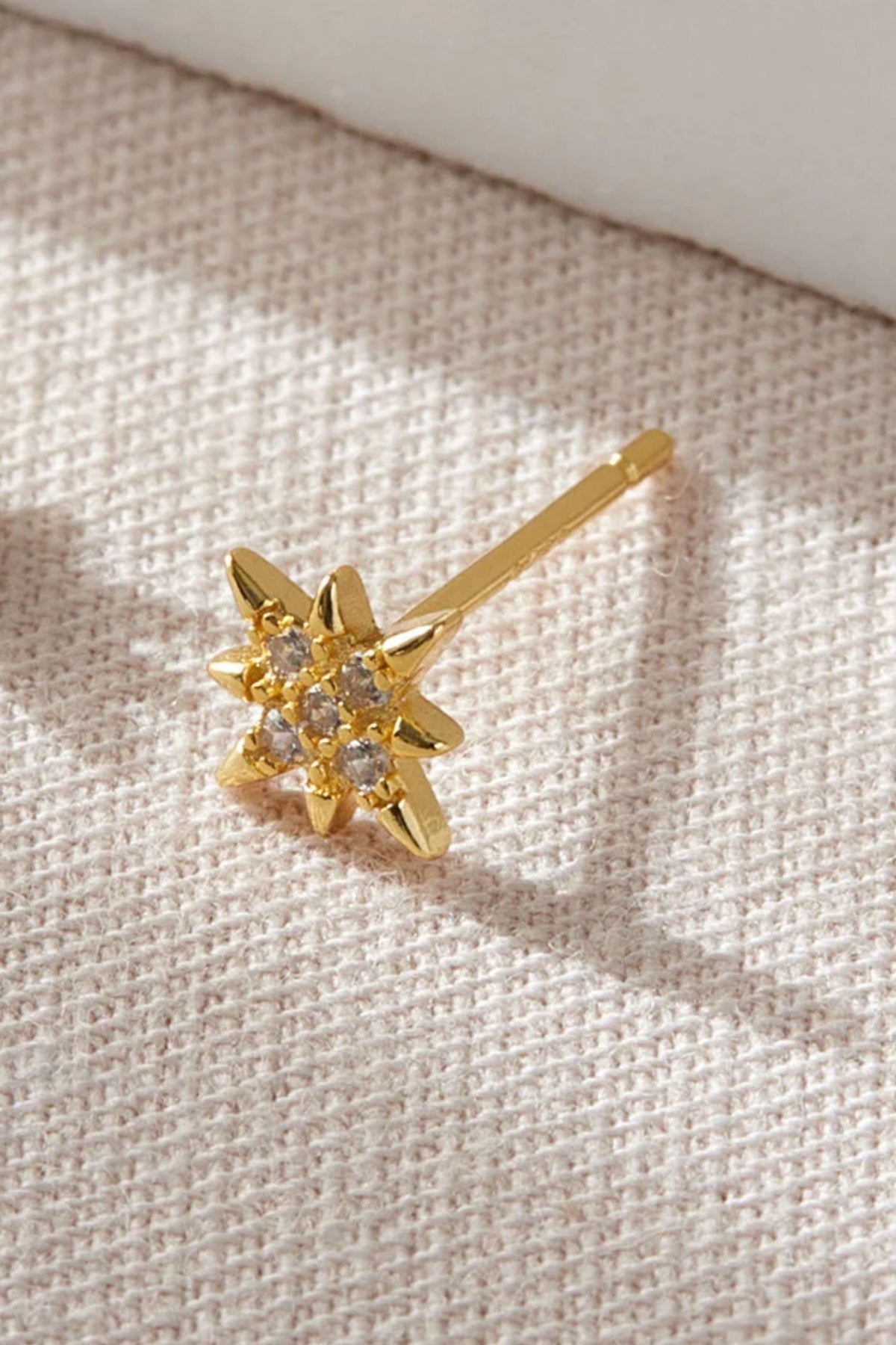 sterling-silver-cz-starburst-studs-in-gold-1-closeup