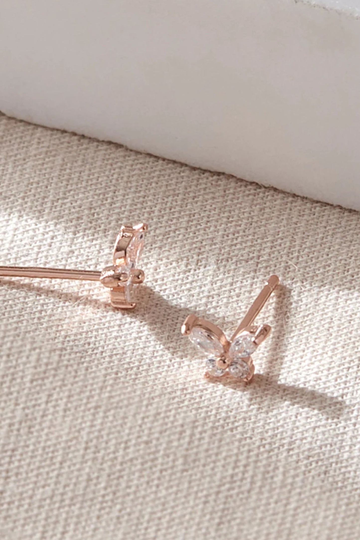 sterling-silver-cz-butterfly-studs-in-rose-gold-closeup