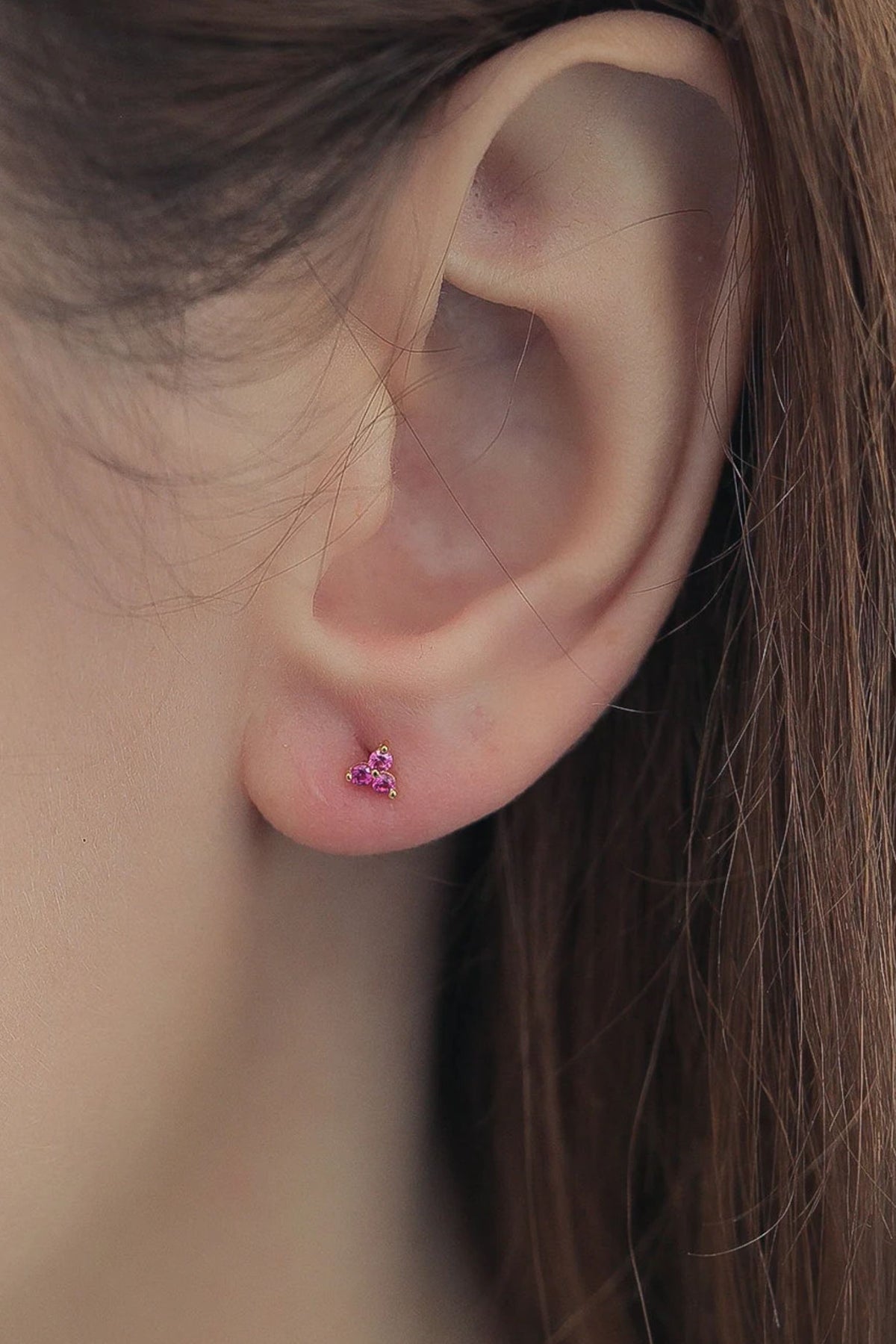 sterling-silver-cz-tiny-studs-in-gold-pink-model
