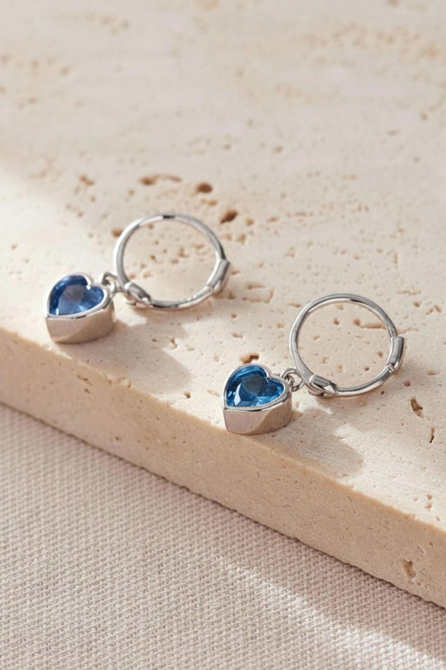 sterling-silver-cz-heart-hoops-in-silver-light-blue