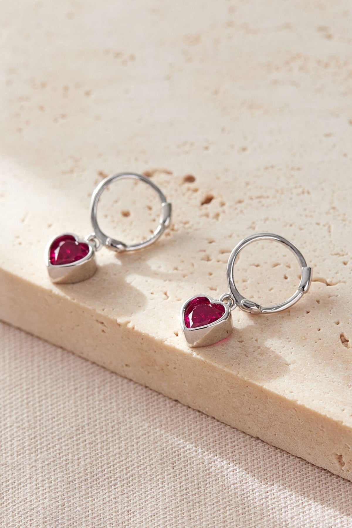 sterling-silver-cz-heart-hoops-in-silver-fuchsia