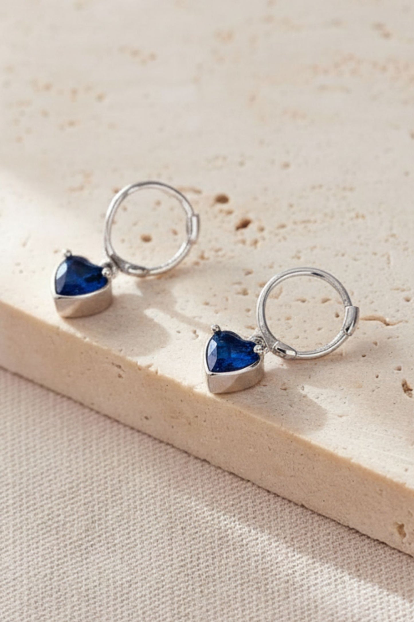sterling-silver-cz-heart-hoops-in-silver-midnight-blue